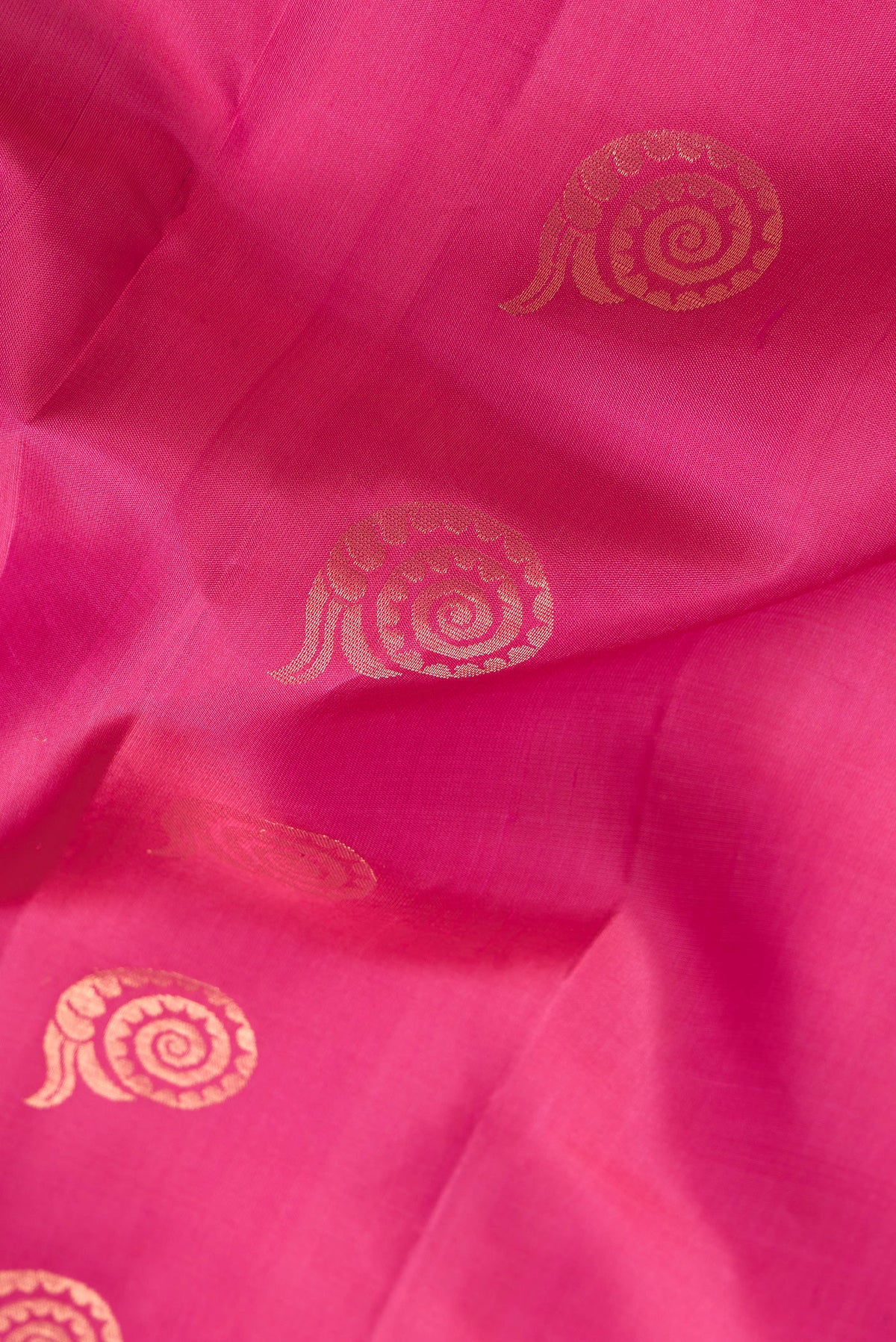 Close up of Pink Dual Tone Soft Silk Saree with Zari Butta on the body and Without Border.  displaying folds