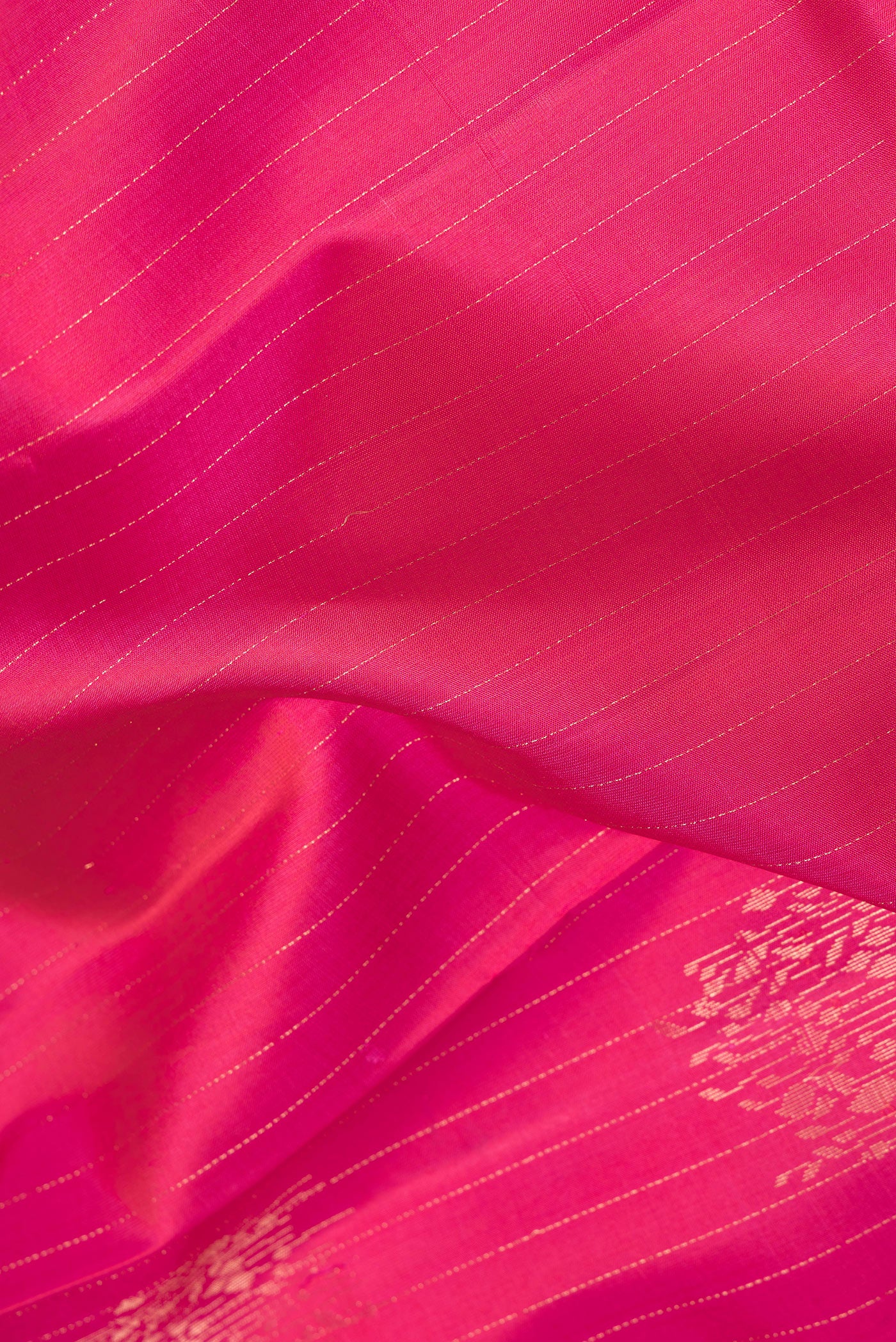 Close up of Pink Dual Tone Soft Silk Saree with Stripes on the body and Without Border.  displaying folds