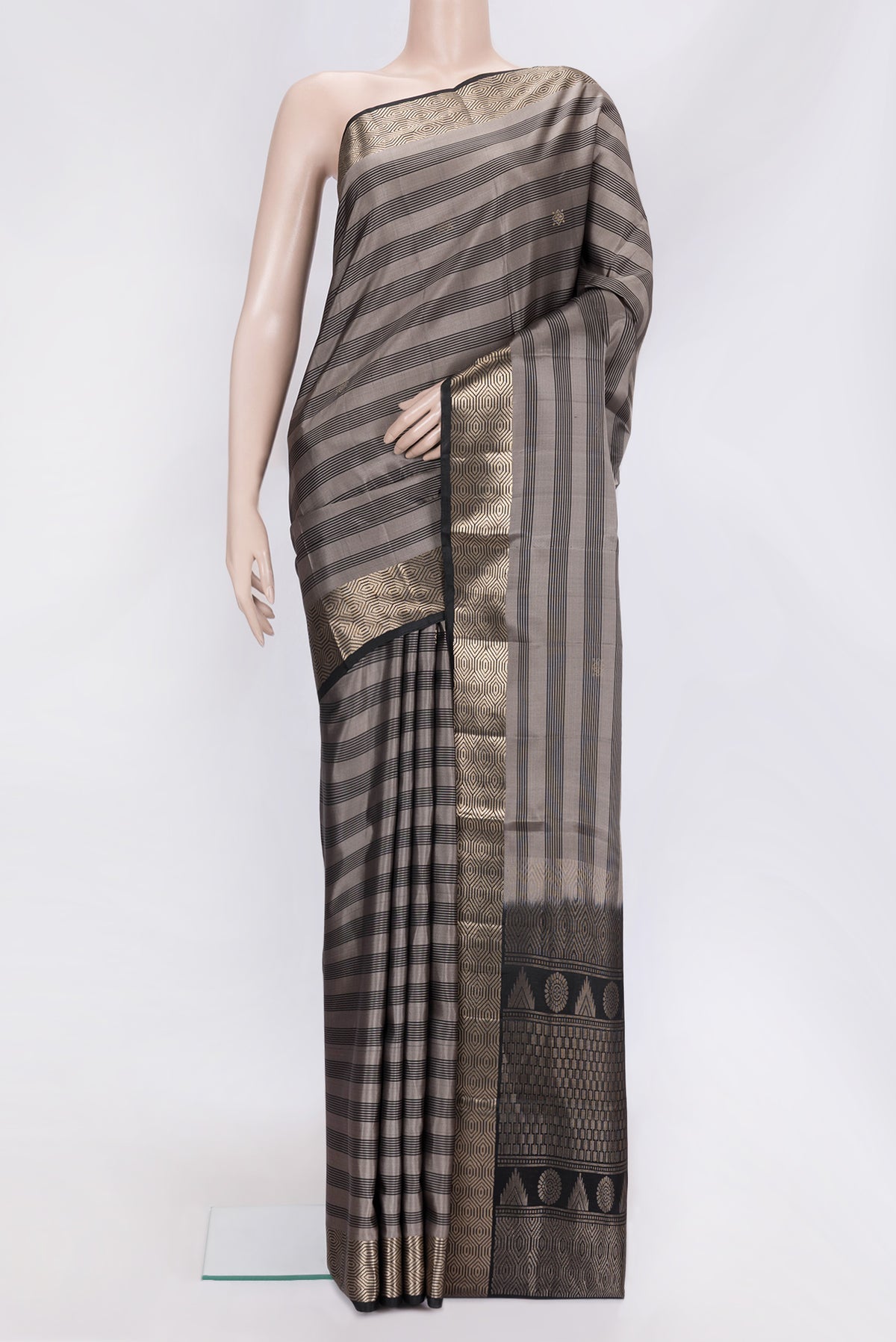 Grey Dual Tone Soft Silk Saree with Stripes on the body and Zari Border.  displayed on a mannequin