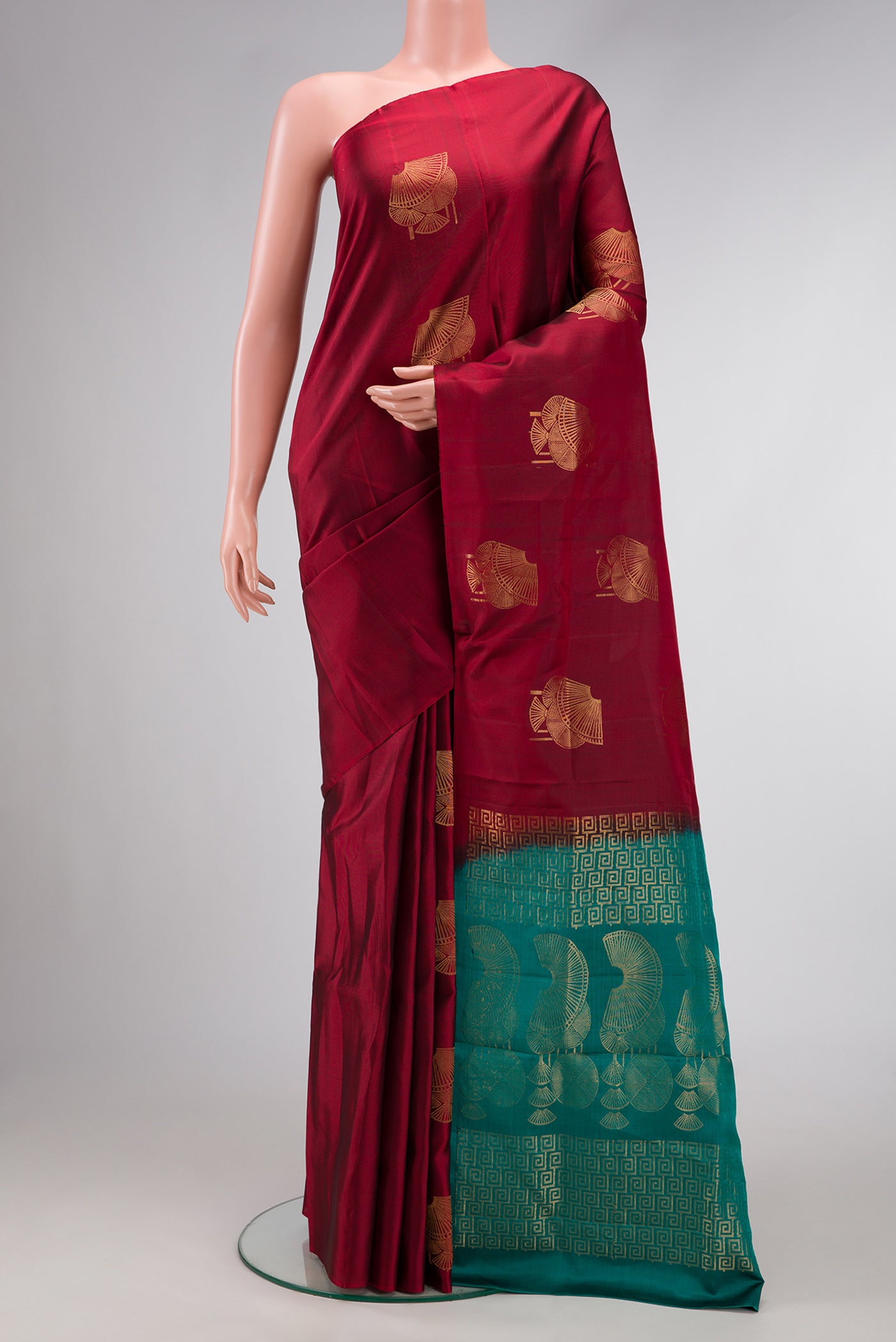 Maroon Dual Tone Soft Silk Saree with Zari Butta on the body and Without Border.  displayed on a mannequin
