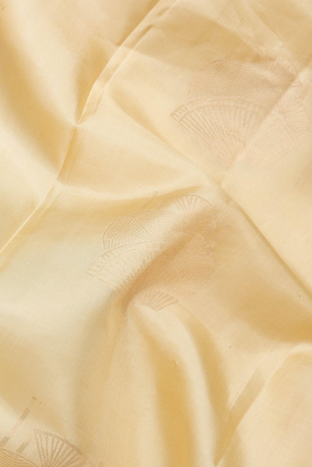 Close up of Sandal Dual Tone Soft Silk Saree with Zari Butta on the body and Without Border.  displaying folds