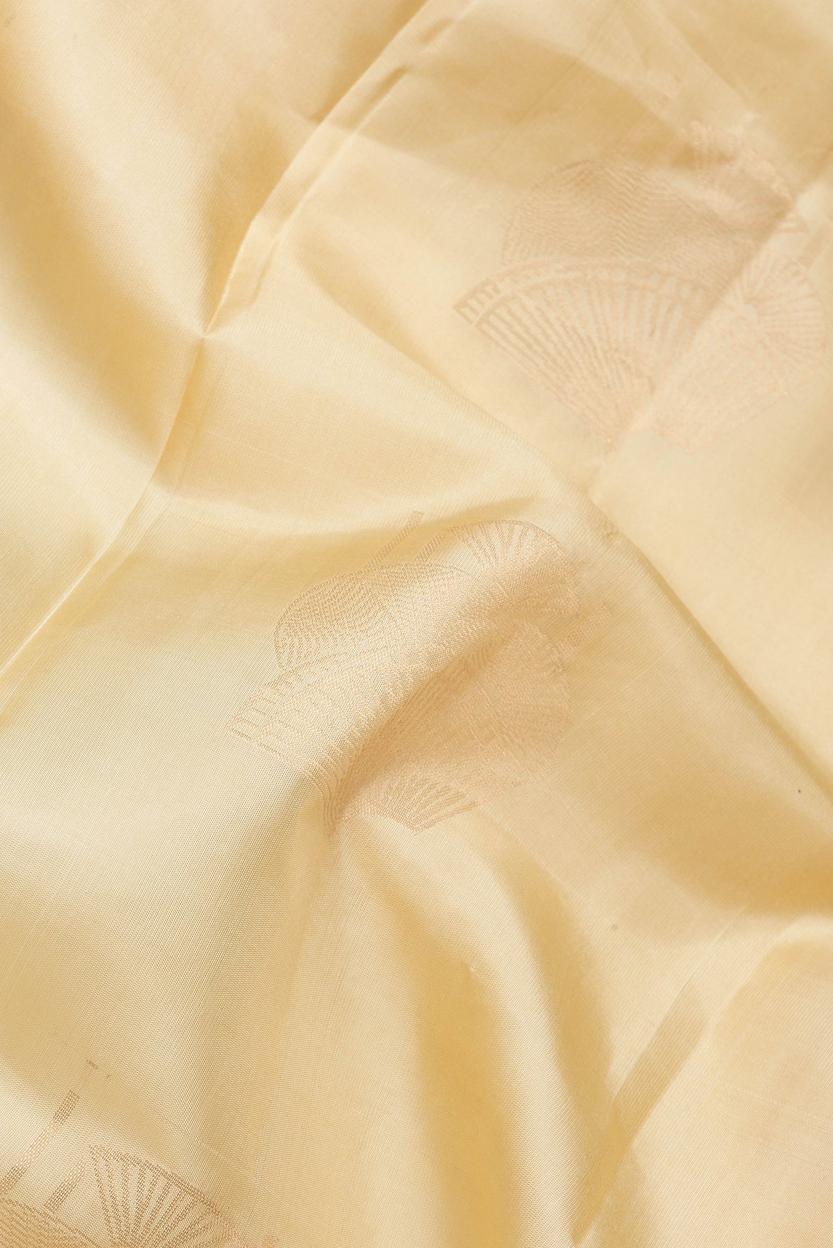 Close up of Sandal Dual Tone Soft Silk Saree with Zari Butta on the body and Without Border.  displaying folds