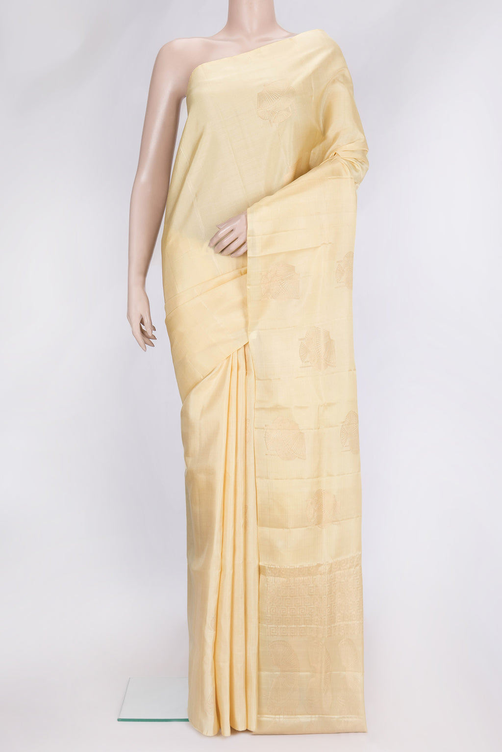 Sandal Dual Tone Soft Silk Saree with Zari Butta on the body and Without Border.  displayed on a mannequin