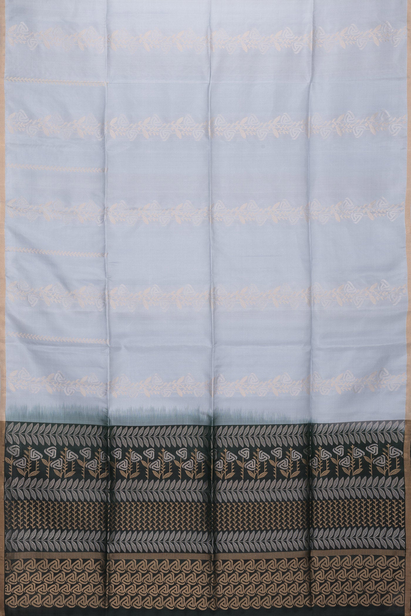 Flat view of Grey Dual Tone Soft Silk Saree with Zari Butta on the body and Zari Border. 