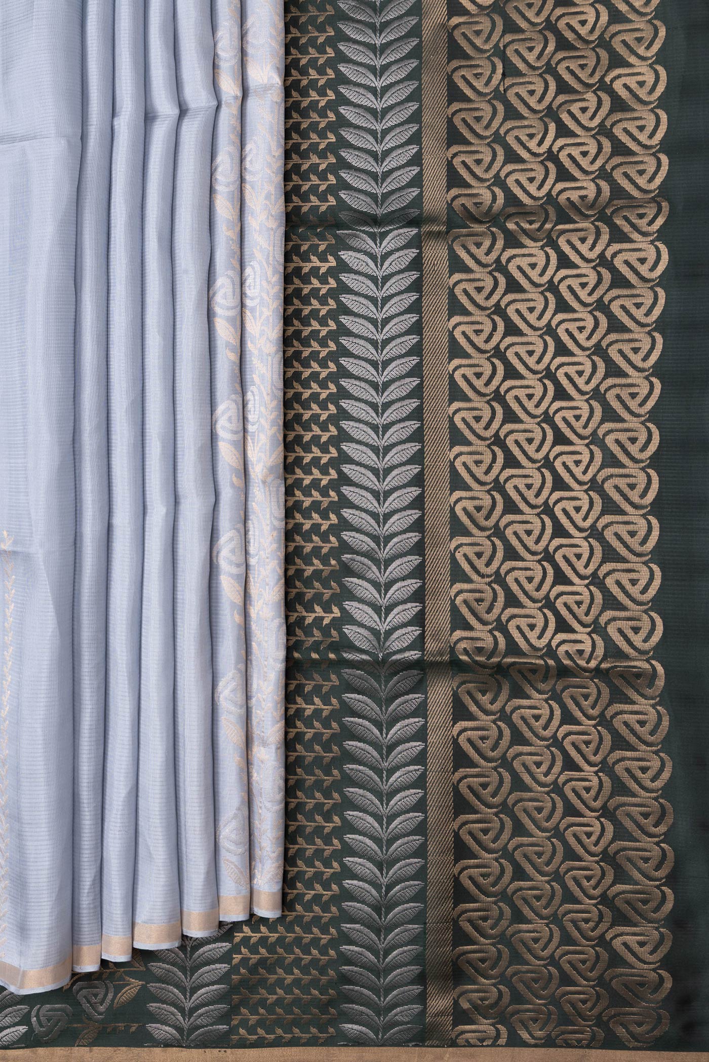 Pleats and pallu of Grey Dual Tone Soft Silk Saree with Zari Butta on the body and Zari Border. 