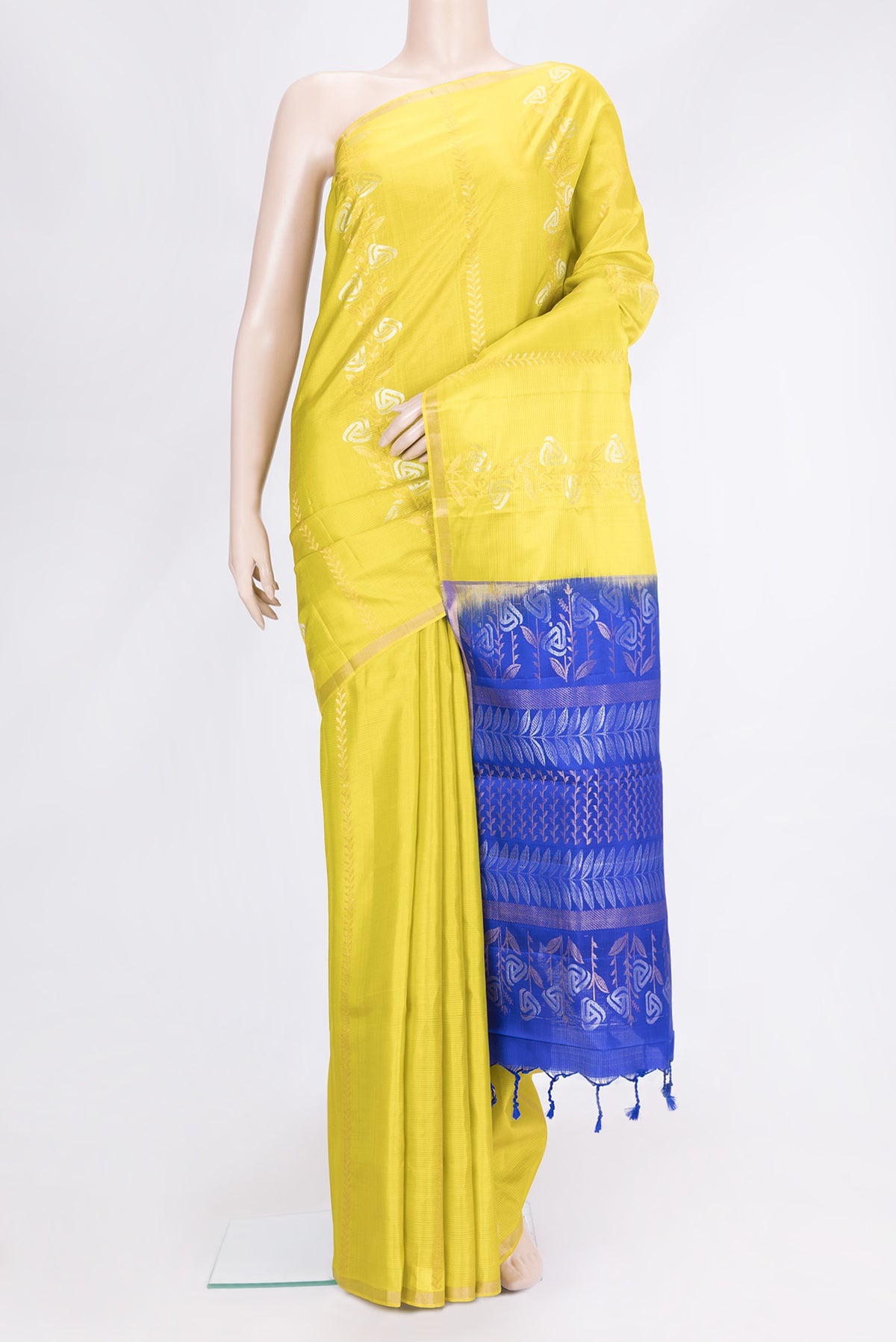 Parrot Green Dual Tone Soft Silk Saree with Zari Butta on the body and Zari Border.  displayed on a mannequin