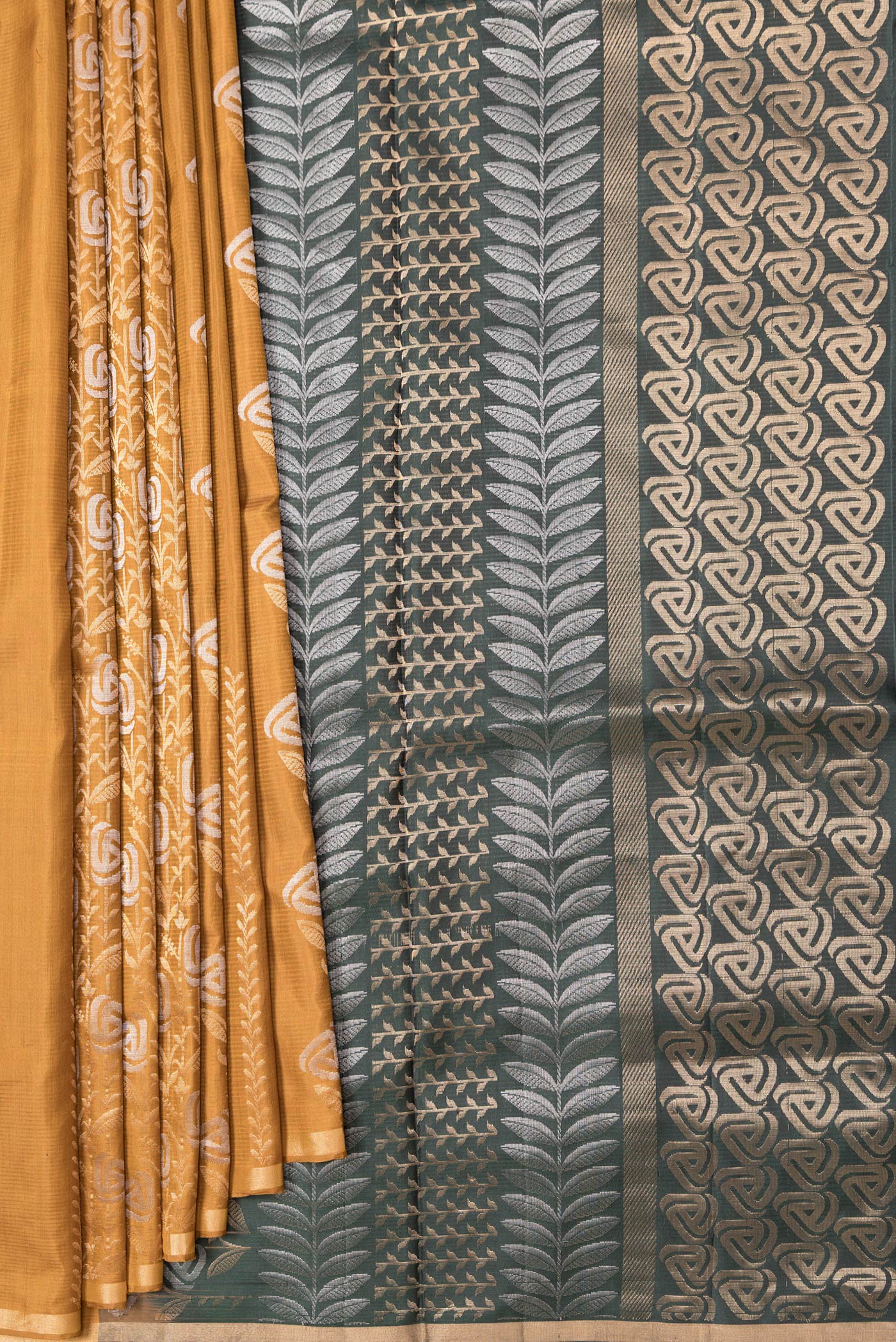 Pleats and pallu of Mustard Dual Tone Soft Silk Saree with Zari Butta on the body and Zari Border. 