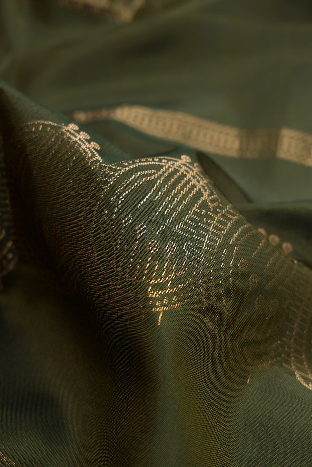 Close up of Mehandi Green Dual Tone Soft Silk Saree with Stripes on the body and Without Border.  displaying folds