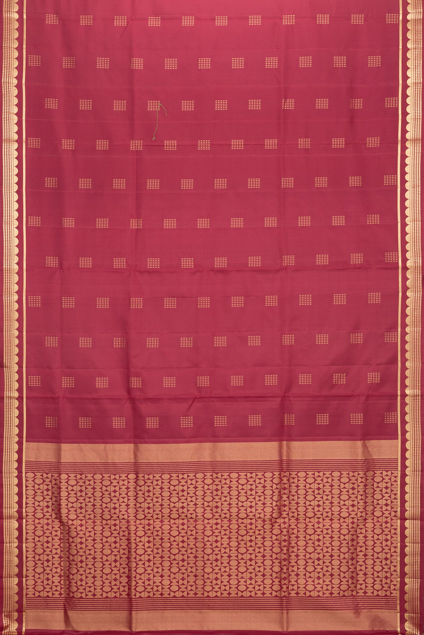 Flat view of Maroon Dual Tone Soft Silk Saree with Zari Butta on the body and Zari Border. 
