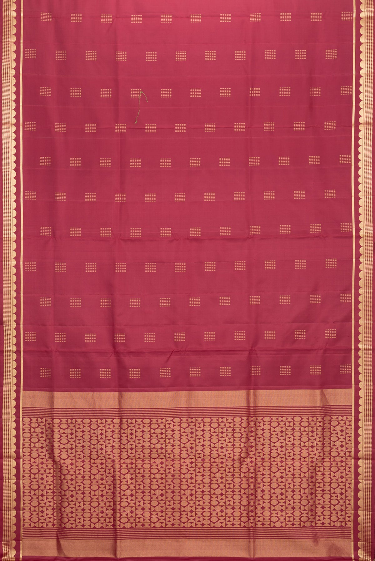 Flat view of Maroon Dual Tone Soft Silk Saree with Zari Butta on the body and Zari Border. 