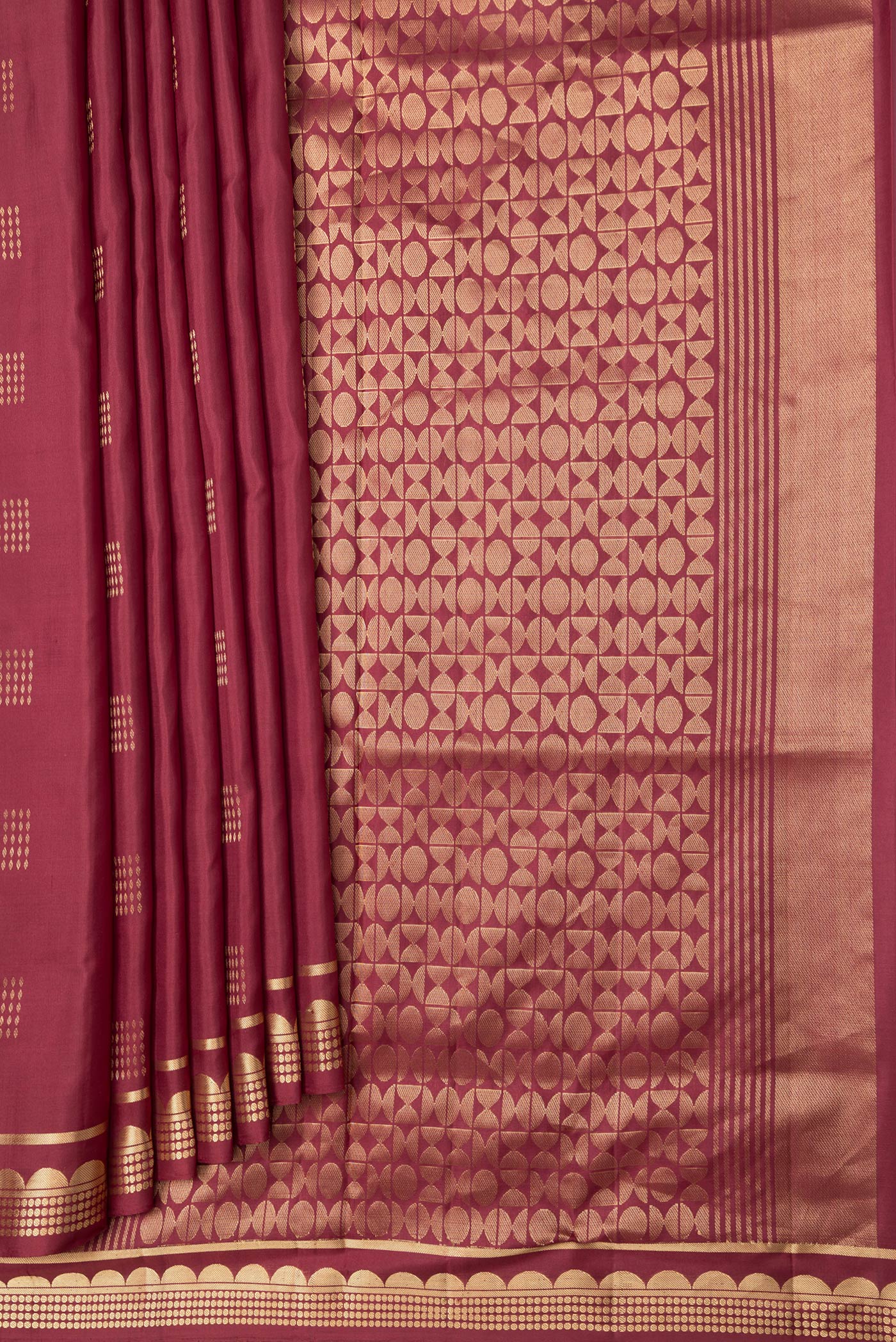 Pleats and pallu of Maroon Dual Tone Soft Silk Saree with Zari Butta on the body and Zari Border. 