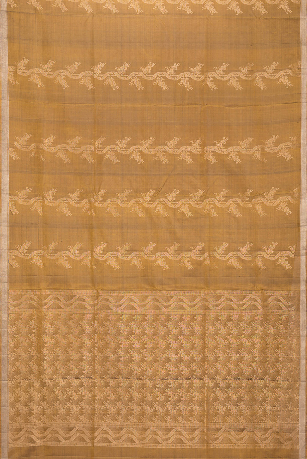 Flat view of Gold Dual Tone Soft Silk Saree with Zari Butta on the body and Zari Border. 