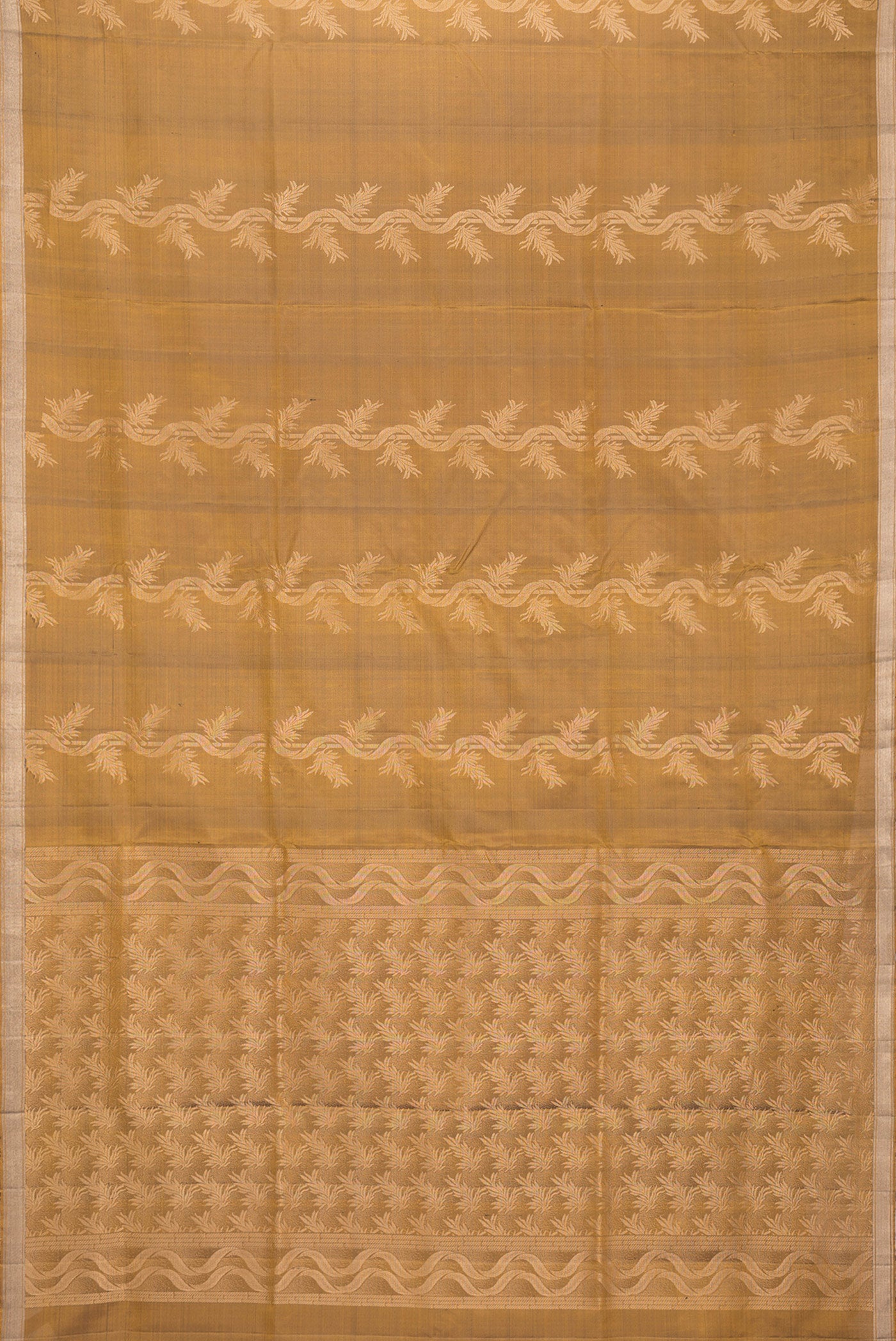 Flat view of Gold Dual Tone Soft Silk Saree with Zari Butta on the body and Zari Border. 