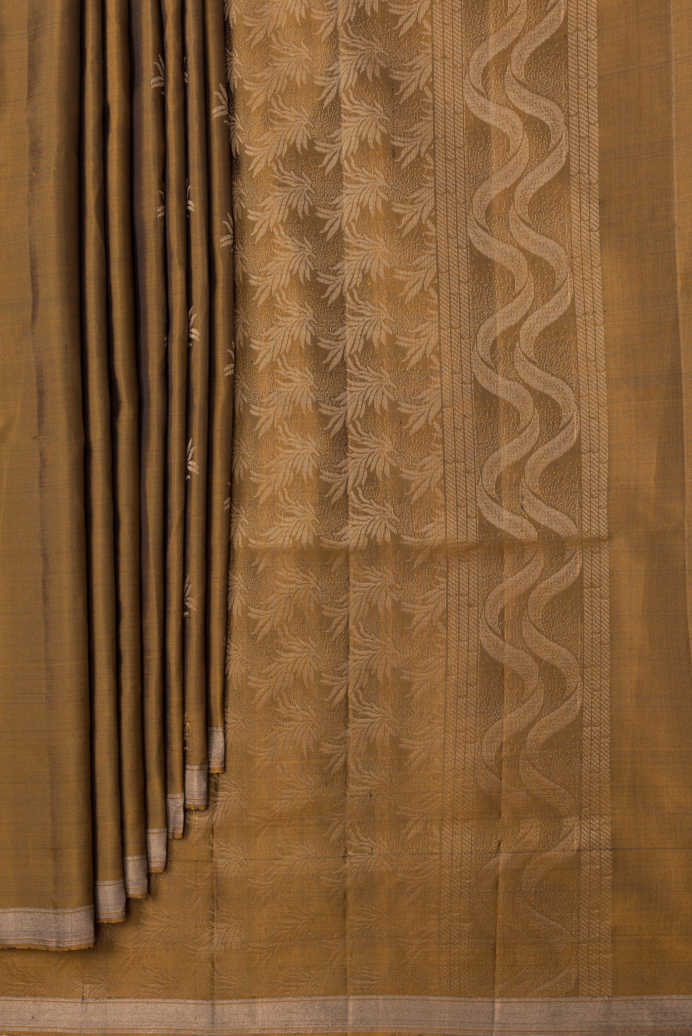 Pleats and pallu of Gold Dual Tone Soft Silk Saree with Zari Butta on the body and Zari Border. 