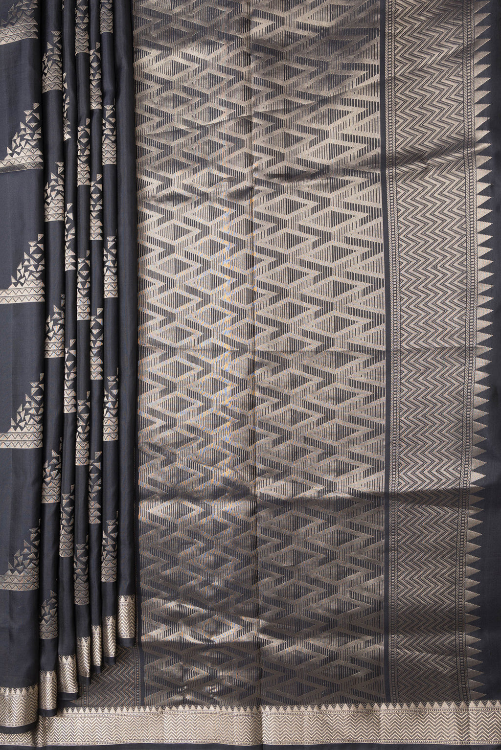 Pleats and pallu of Black Dual Tone Soft Silk Saree with Zari Butta on the body and Zari Border. 