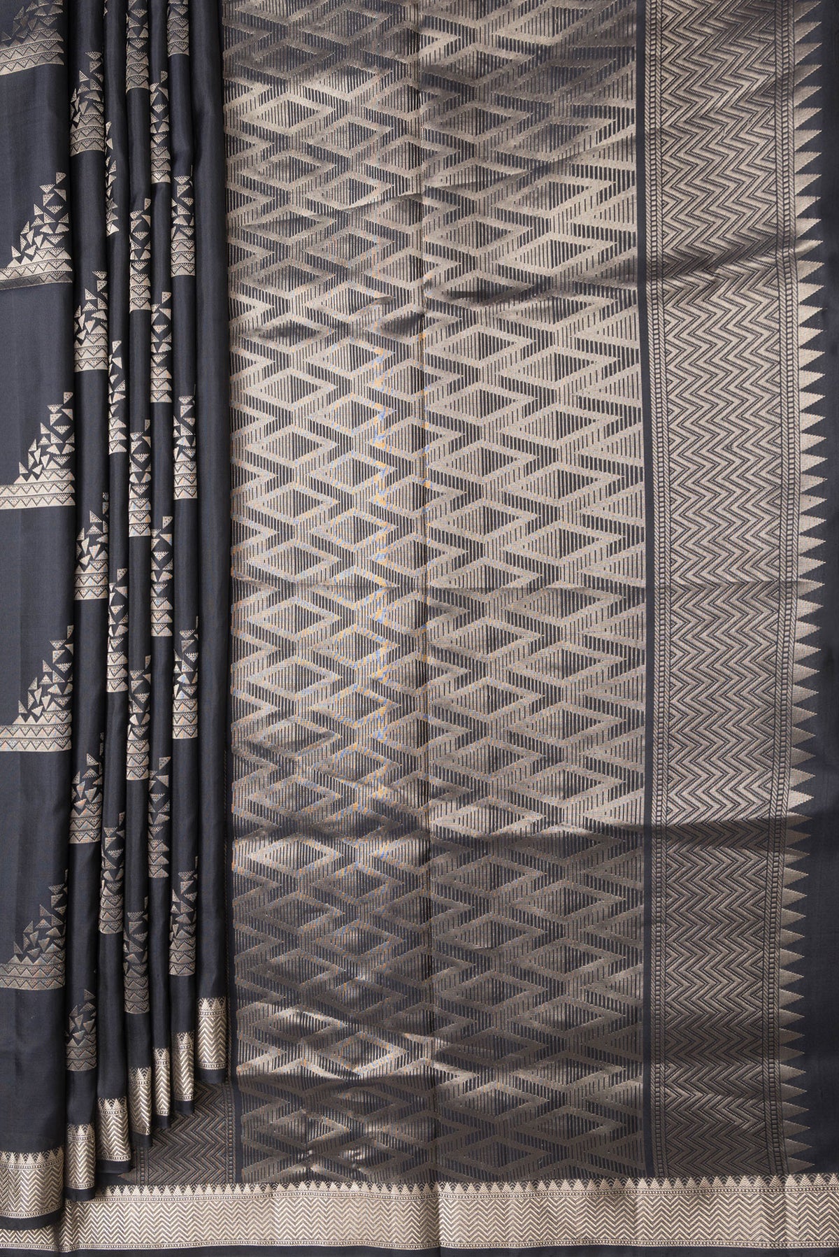 Pleats and pallu of Black Dual Tone Soft Silk Saree with Zari Butta on the body and Zari Border. 