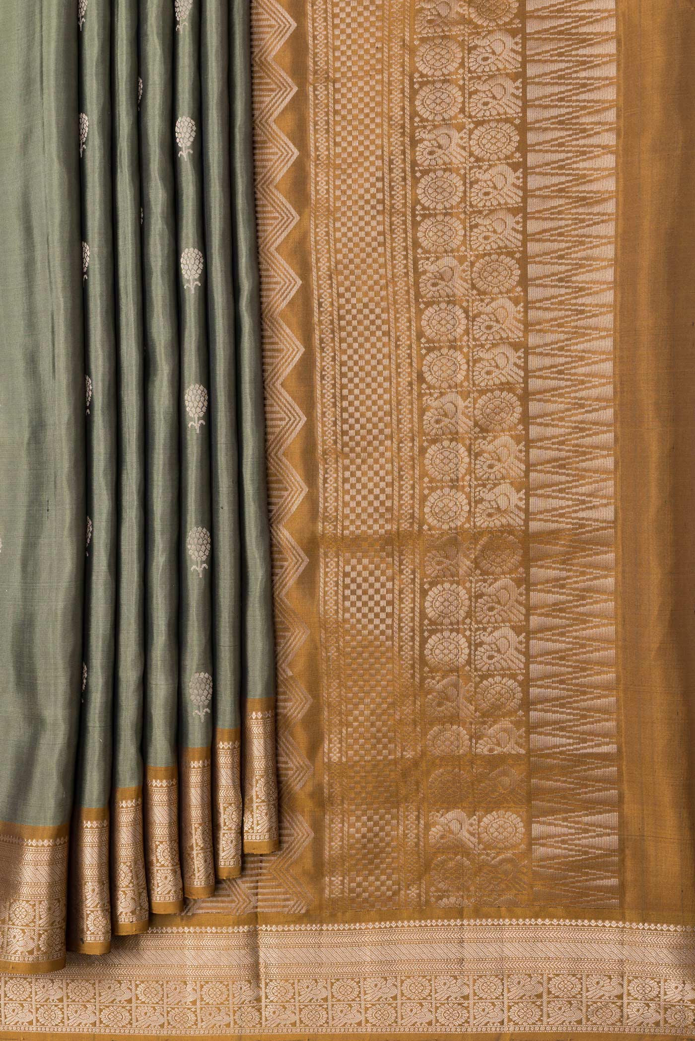 Pleats and pallu of Mehandi Green Dual Tone Soft Silk Saree with Zari Butta on the body and Zari Border. 