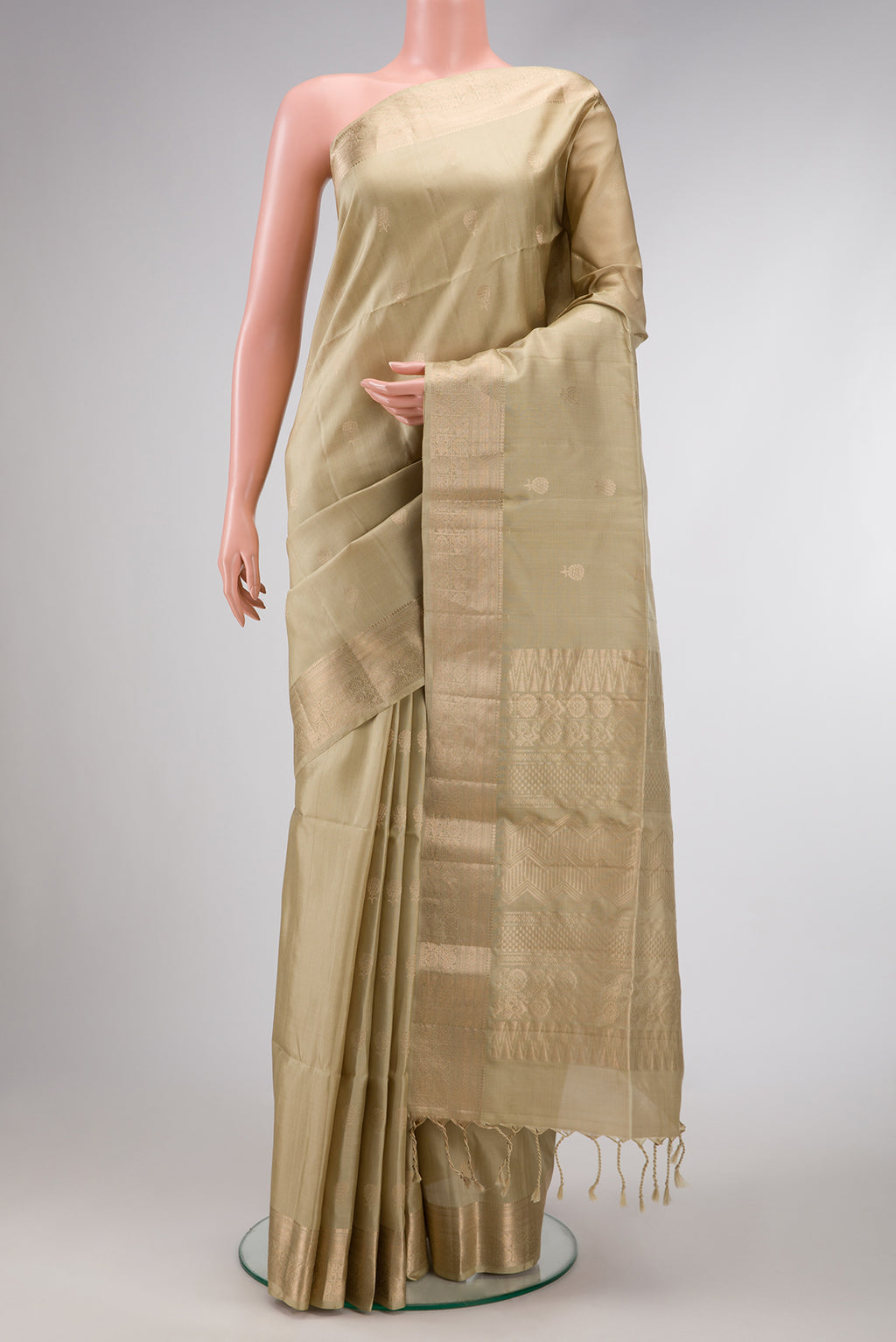 Mehandi Green Dual Tone Soft Silk Saree with Zari Butta on the body and Zari Border.  displayed on a mannequin