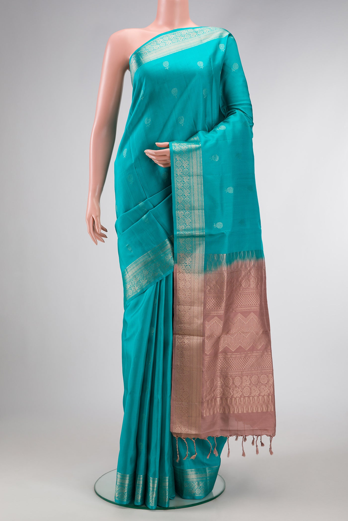 Maya Blue Dual Tone Soft Silk Saree with Zari Butta on the body and Zari Border.  displayed on a mannequin
