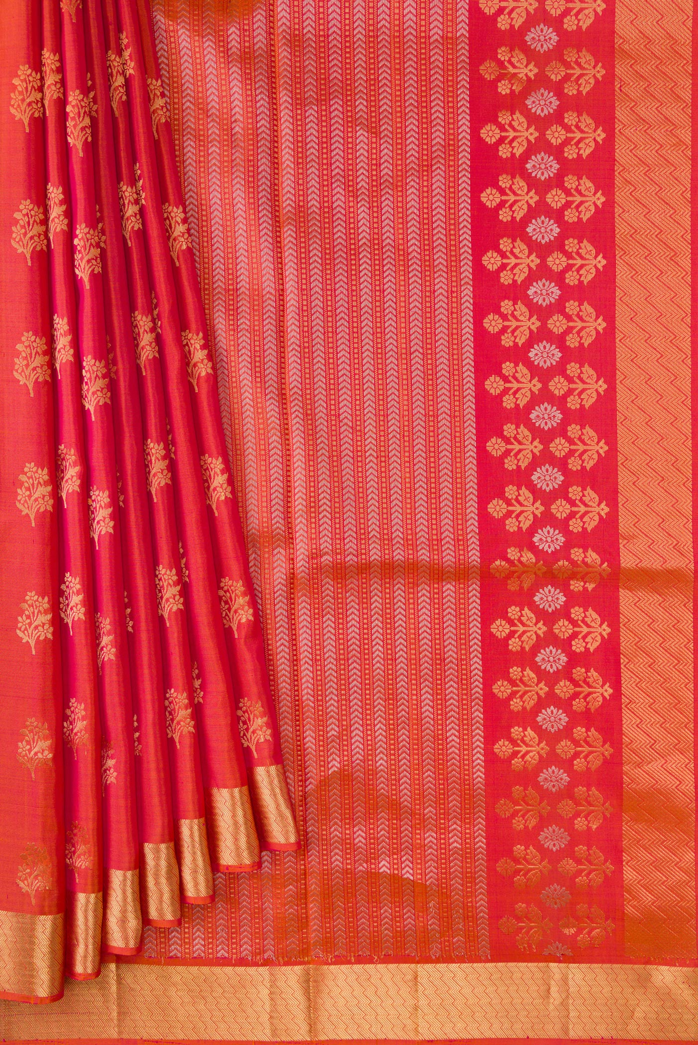 Pleats and pallu of Brick Orange Dual Tone Soft Silk Saree with Zari Butta on the body and Zari Border. 