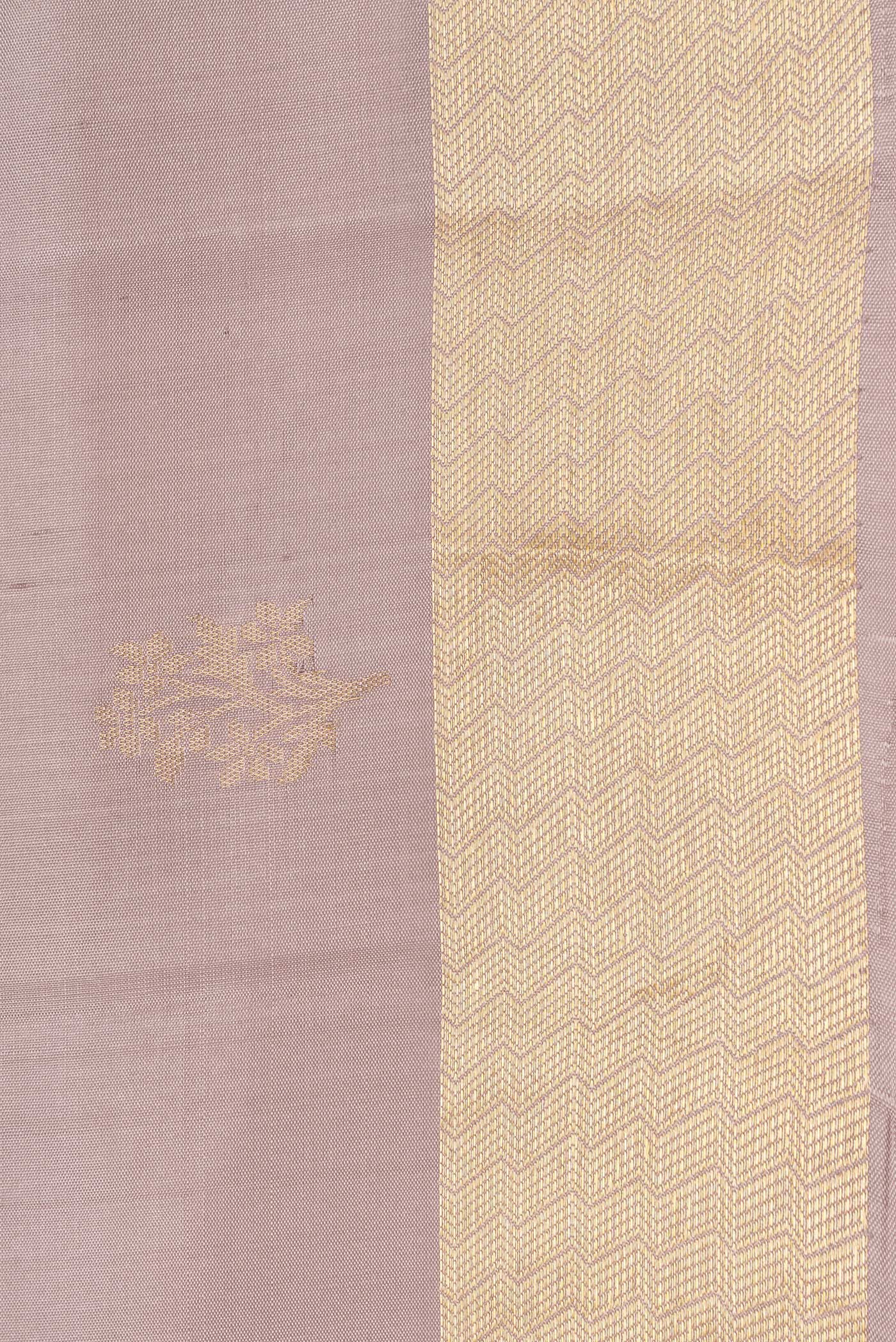 Border image of Beige Dual Tone Soft Silk Saree with Zari Butta on the body and Zari Border. 