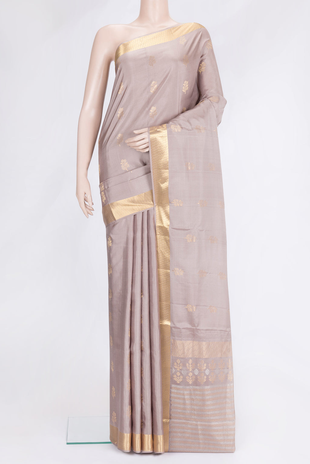 Beige Dual Tone Soft Silk Saree with Zari Butta on the body and Zari Border.  displayed on a mannequin