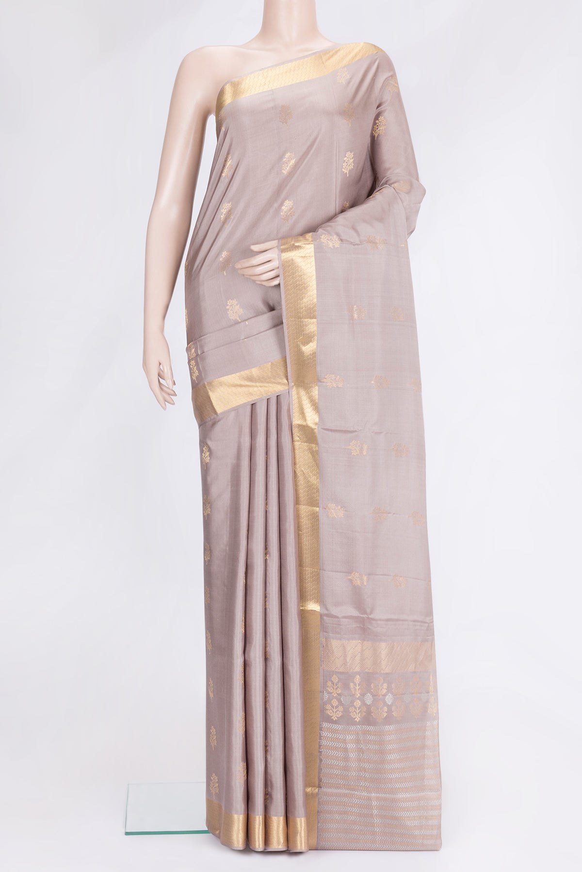 Beige Dual Tone Soft Silk Saree with Zari Butta on the body and Zari Border.  displayed on a mannequin