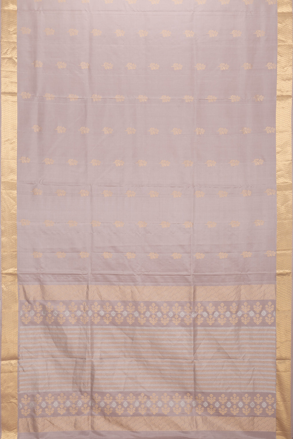 Flat view of Beige Dual Tone Soft Silk Saree with Zari Butta on the body and Zari Border. 