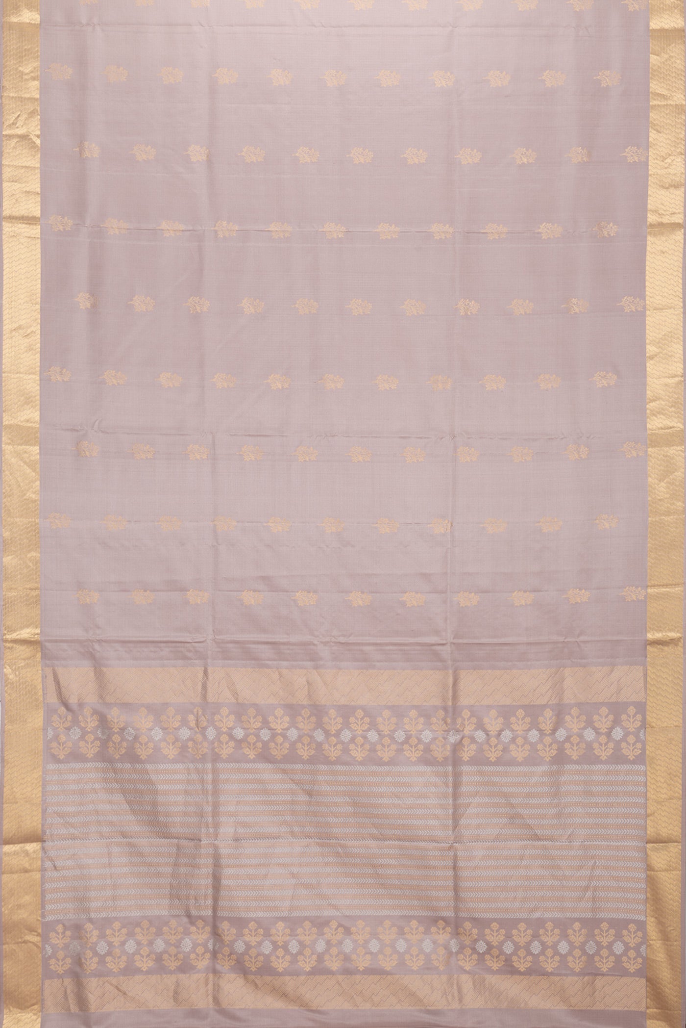 Flat view of Beige Dual Tone Soft Silk Saree with Zari Butta on the body and Zari Border. 