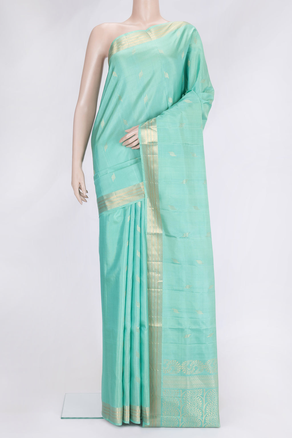 Sea Green Dual Tone Soft Silk Saree with Zari Butta on the body and Zari Border.  displayed on a mannequin