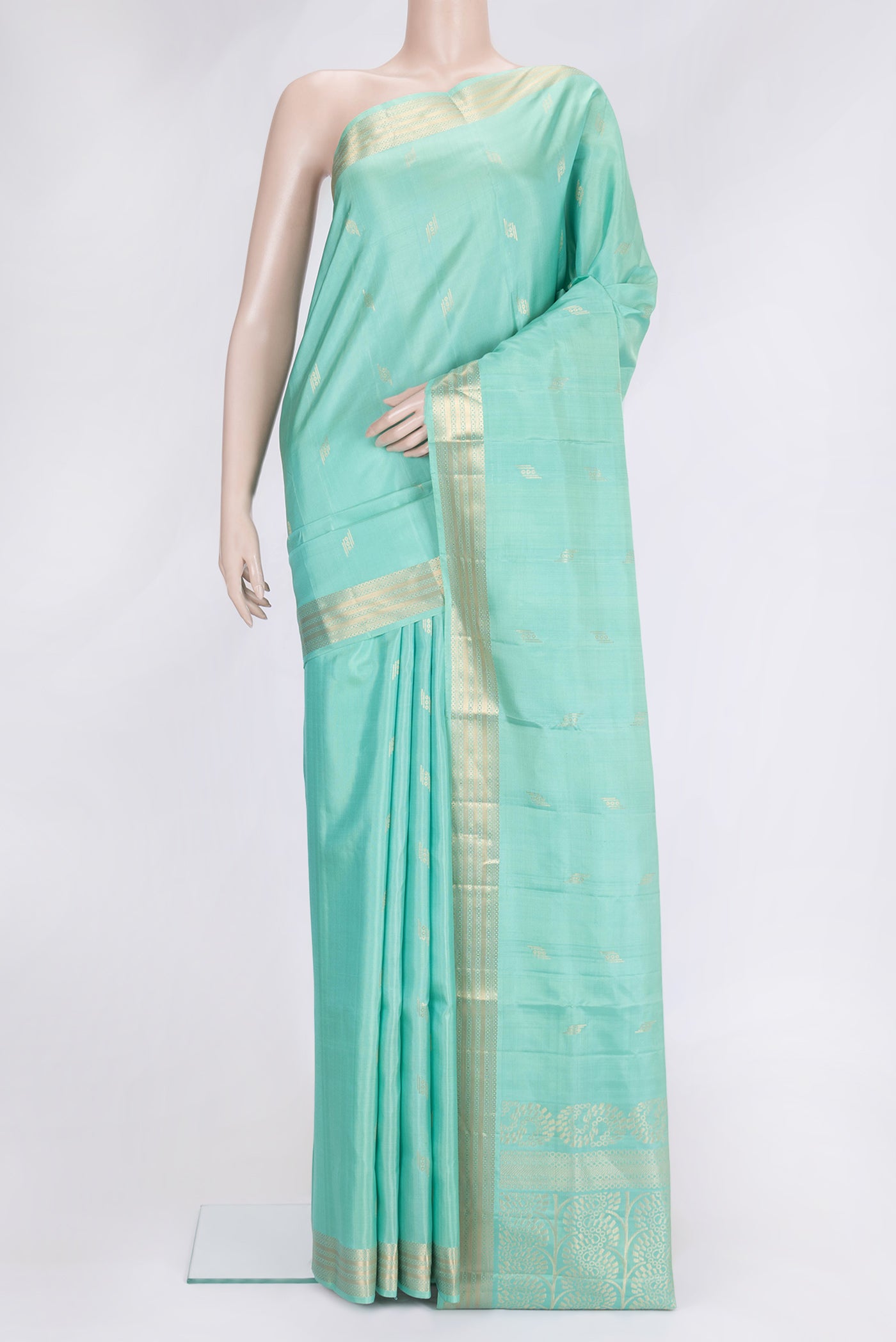 Sea Green Dual Tone Soft Silk Saree with Zari Butta on the body and Zari Border.  displayed on a mannequin