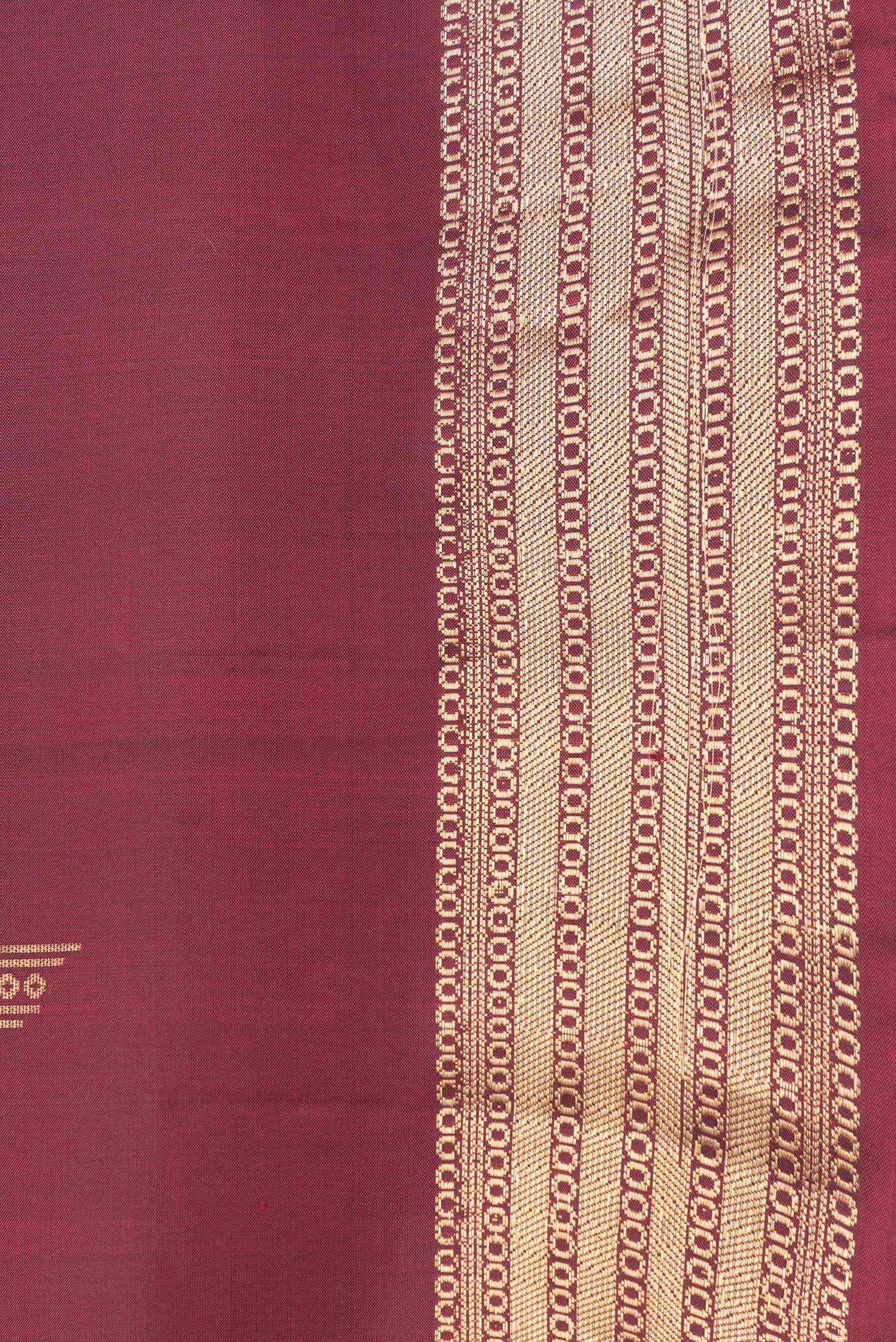 Border image of Maroon Dual Tone Soft Silk Saree with Zari Butta on the body and Zari Border. 
