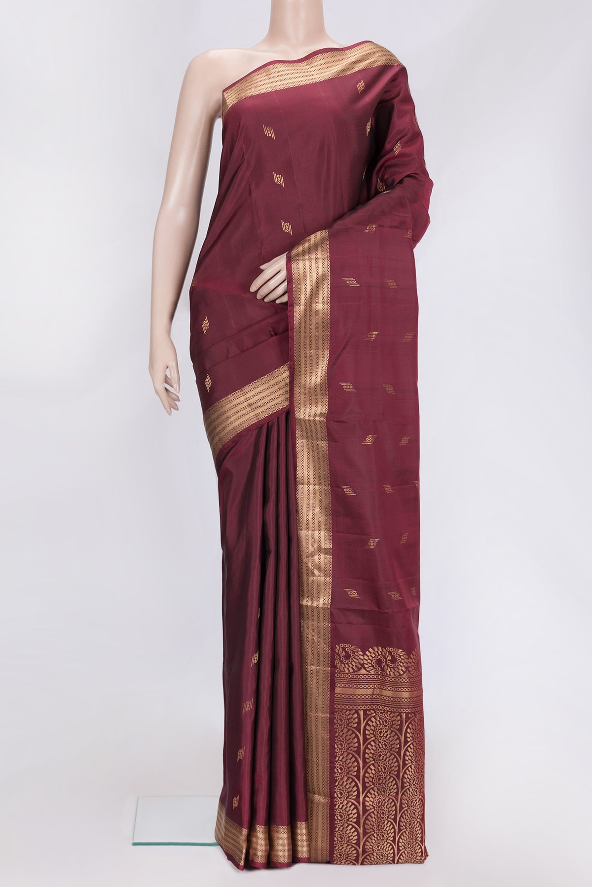 Maroon Dual Tone Soft Silk Saree with Zari Butta on the body and Zari Border.  displayed on a mannequin