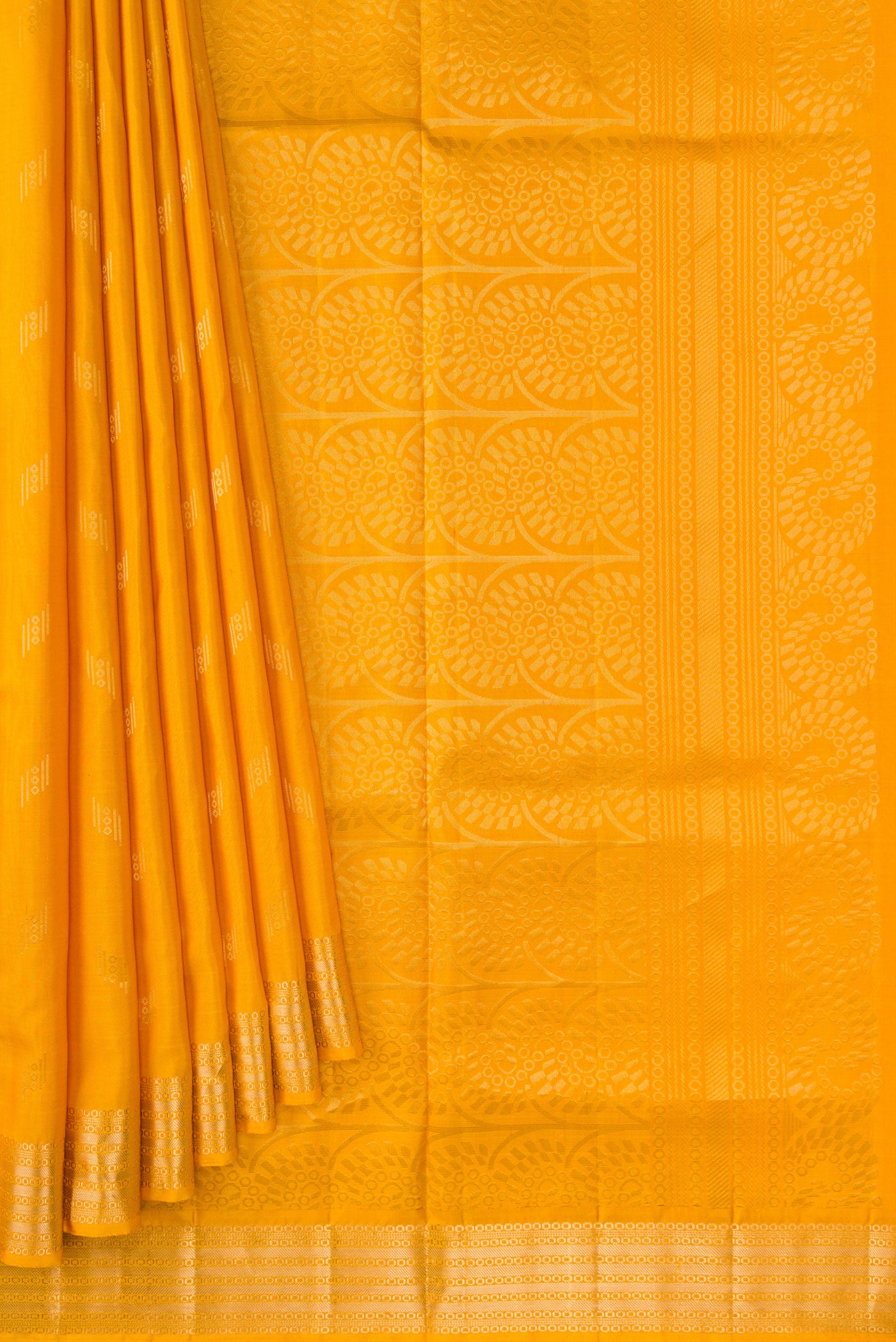 Pleats and pallu of Mustard Dual Tone Soft Silk Saree with Zari Butta on the body and Zari Border. 