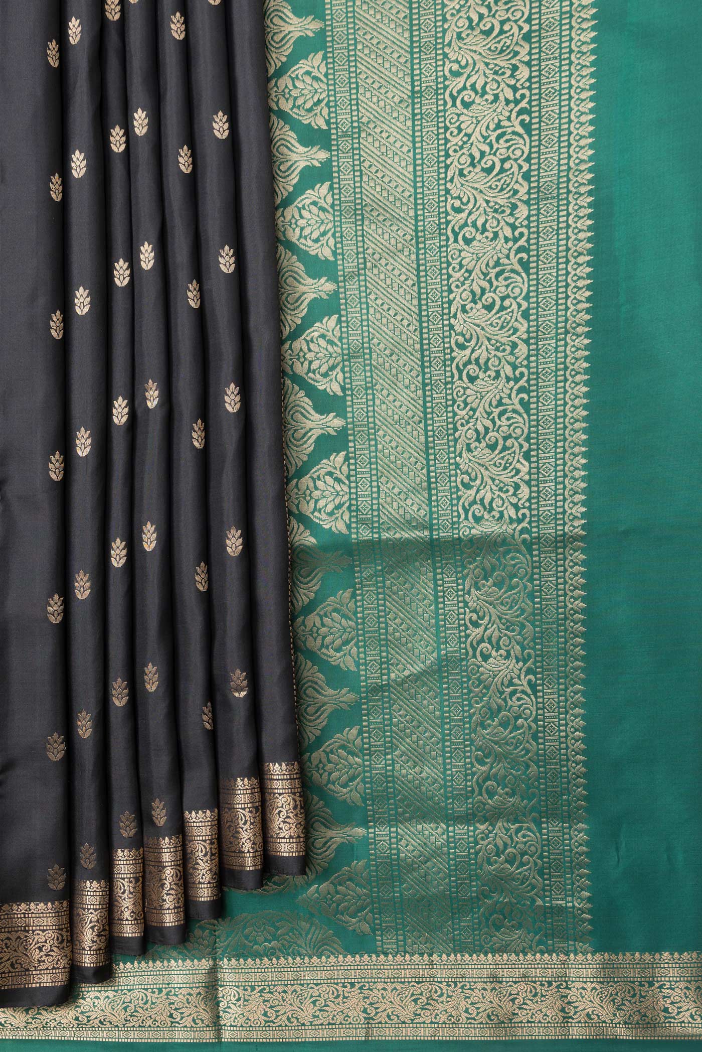 Pleats and pallu of Black Dual Tone Soft Silk Saree with Zari Butta on the body and Zari Border. 
