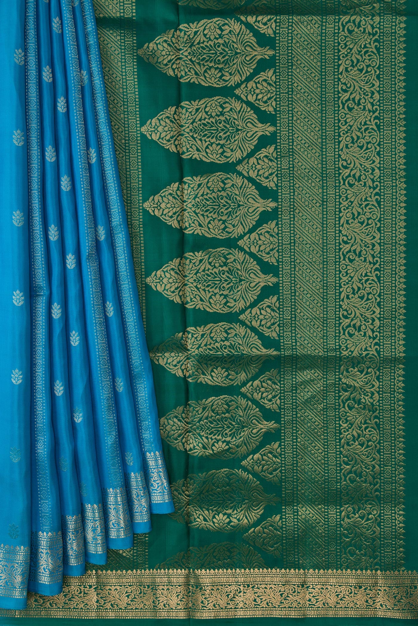 Pleats and pallu of Sky Blue Dual Tone Soft Silk Saree with Zari Butta on the body and Zari Border. 