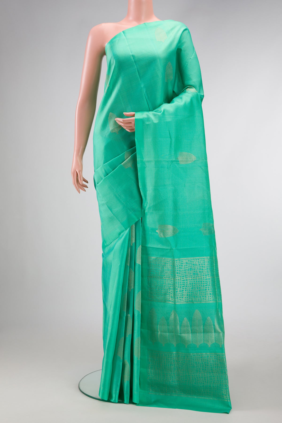 Sea Green Dual Tone Soft Silk Saree with Zari Butta on the body and Without Border.  displayed on a mannequin