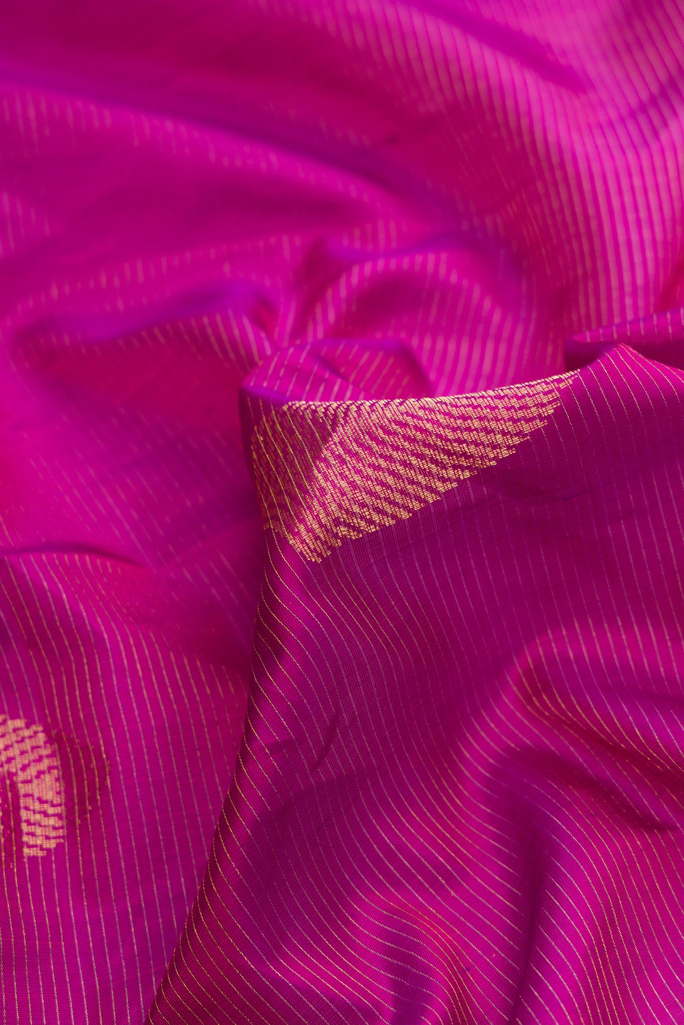 Close up of Purple Dual Tone Soft Silk Saree with Stripes on the body and Without Border.  displaying folds