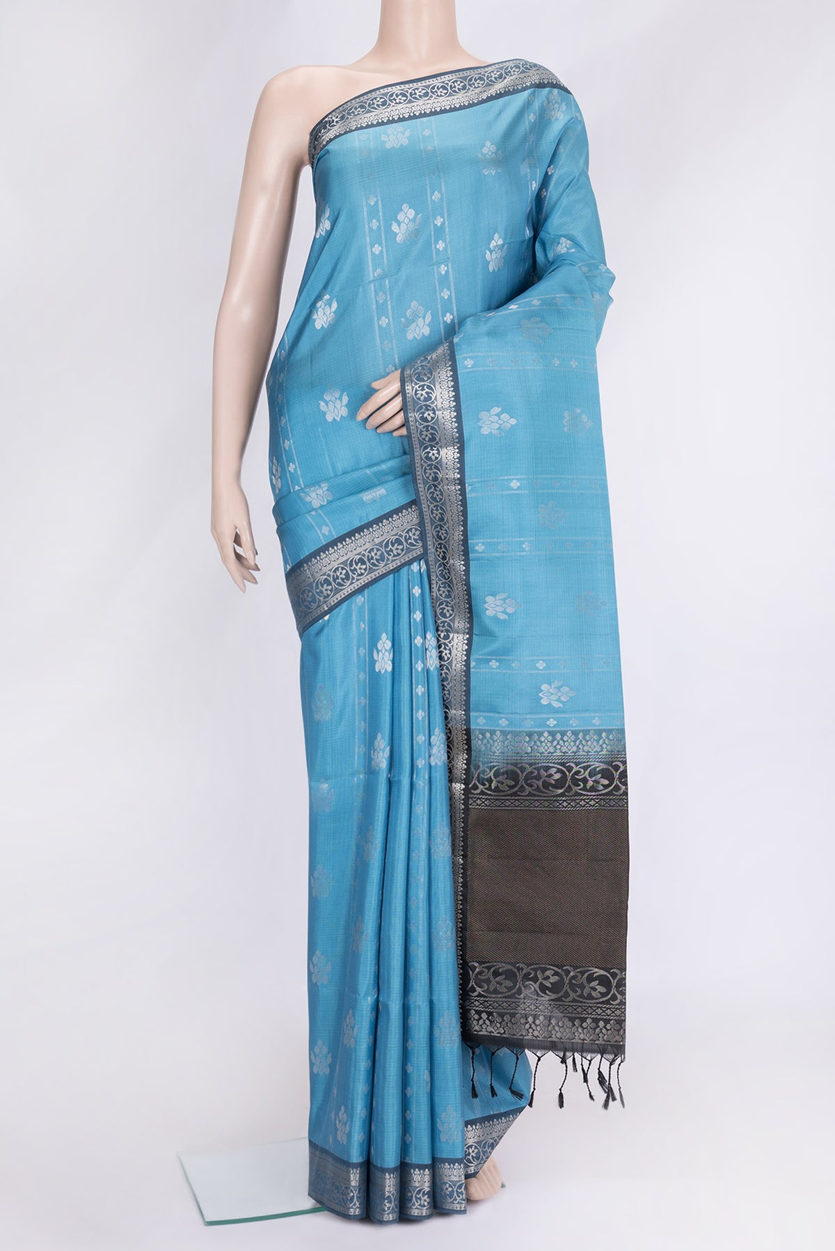 Sky Blue Dual Tone Soft Silk Saree with Zari Butta on the body and Zari Border.  displayed on a mannequin