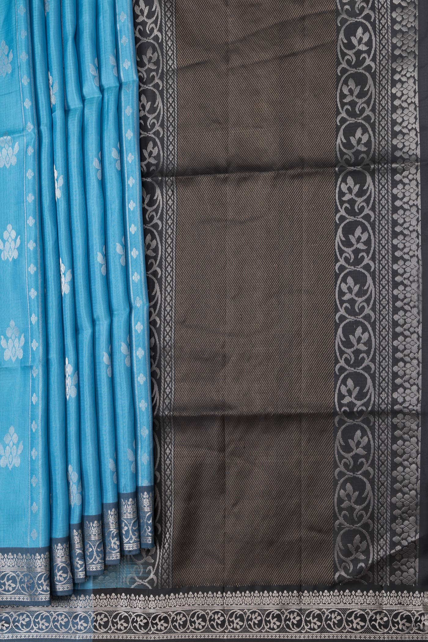 Pleats and pallu of Sky Blue Dual Tone Soft Silk Saree with Zari Butta on the body and Zari Border. 