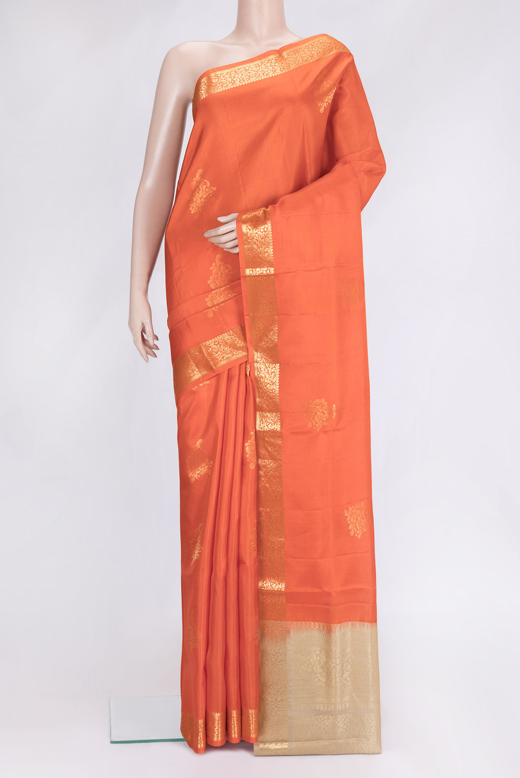 Orange Dual Tone Soft Silk Saree with Zari Butta on the body and Zari Border.  displayed on a mannequin