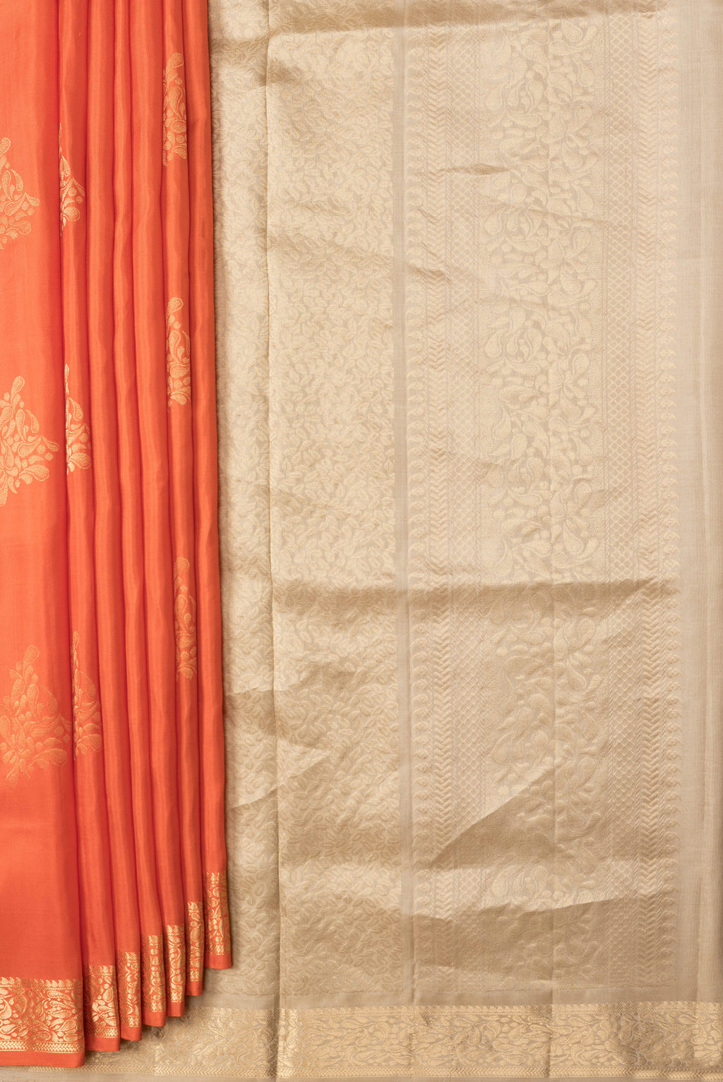 Pleats and pallu of Orange Dual Tone Soft Silk Saree with Zari Butta on the body and Zari Border. 