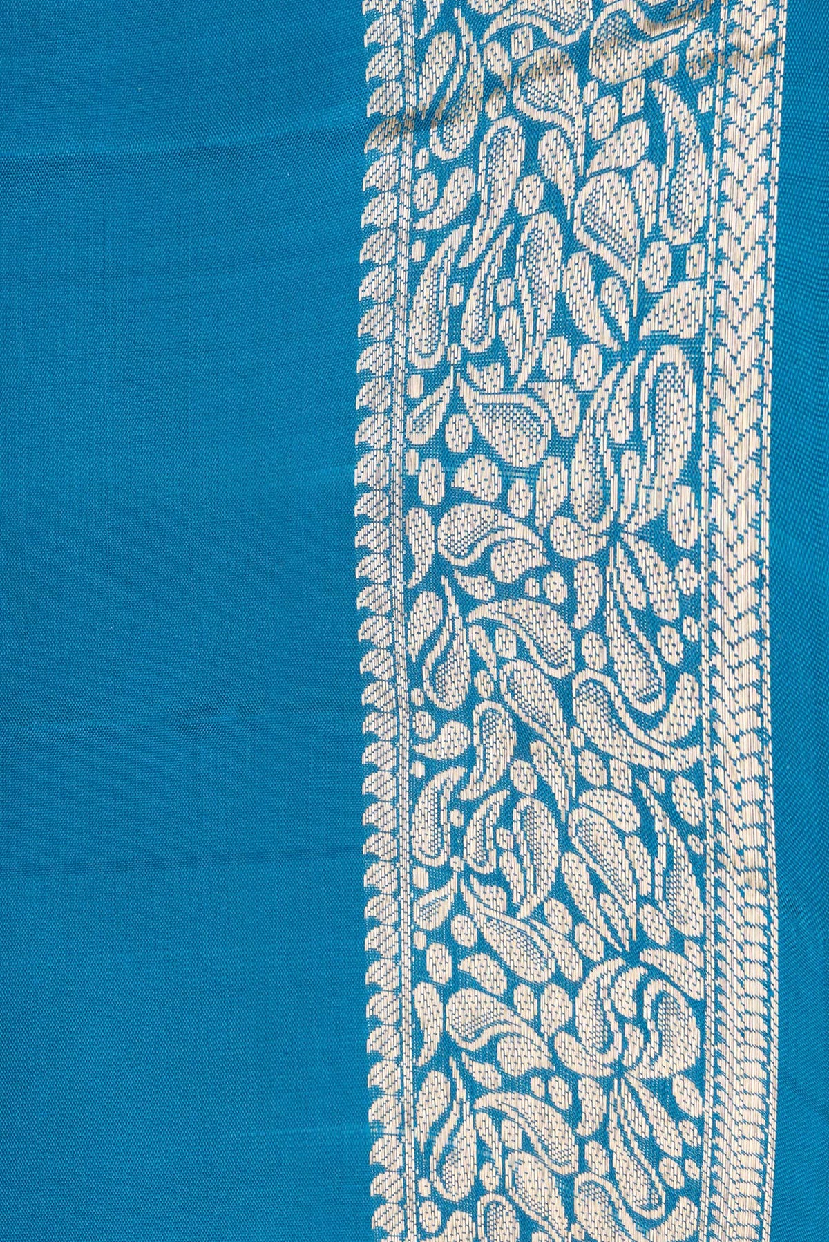 Border image of Peacock Blue Dual Tone Soft Silk Saree with Zari Butta on the body and Zari Border. 