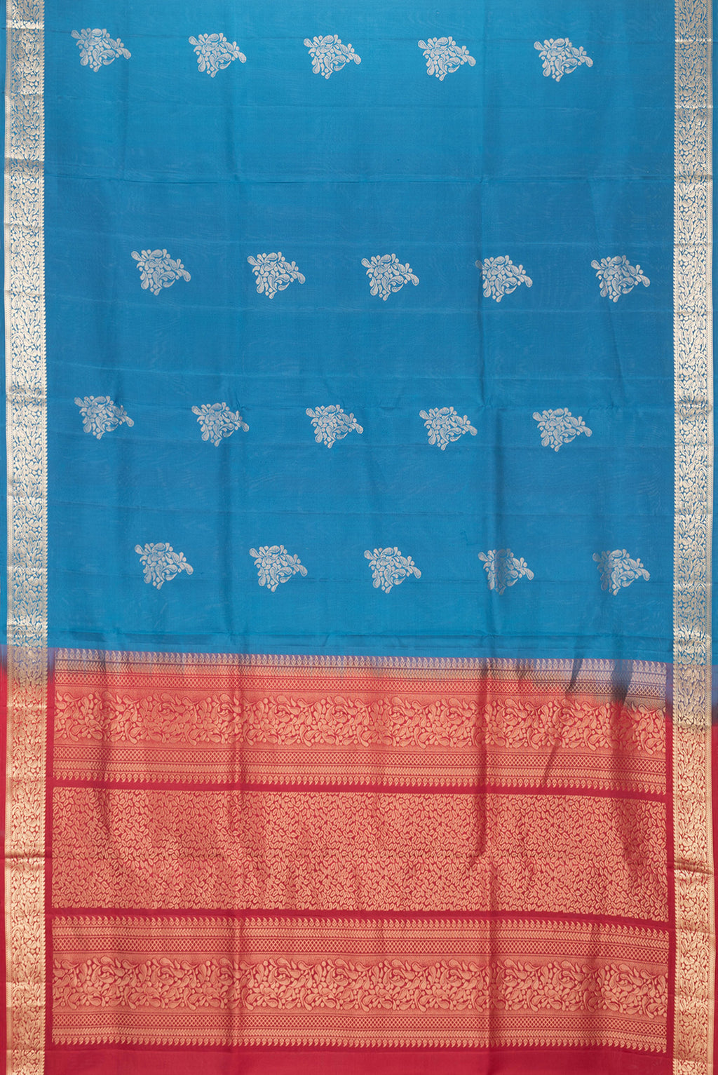 Flat view of Peacock Blue Dual Tone Soft Silk Saree with Zari Butta on the body and Zari Border. 