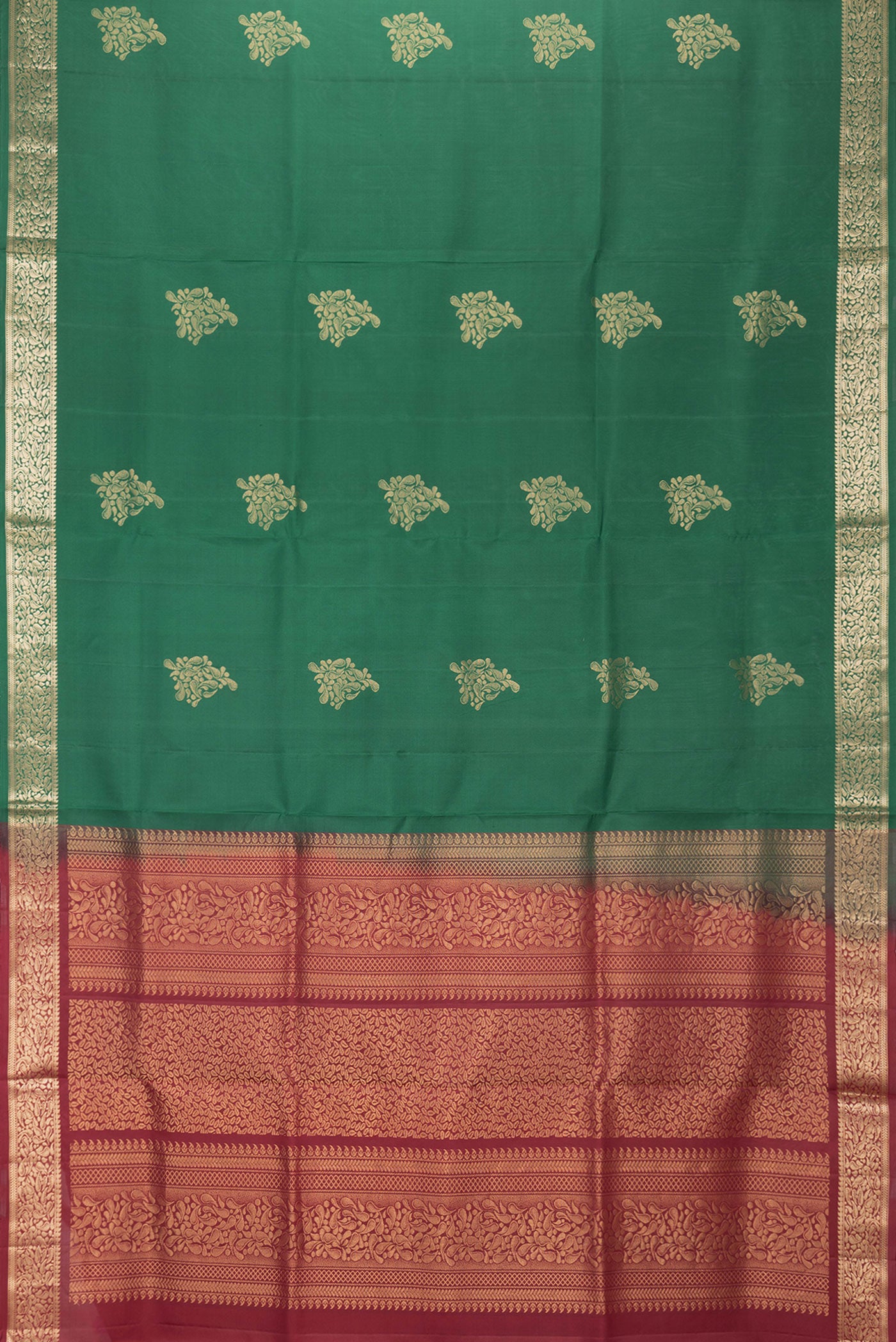 Flat view of Bottle Green Dual Tone Soft Silk Saree with Zari Butta on the body and Zari Border. 