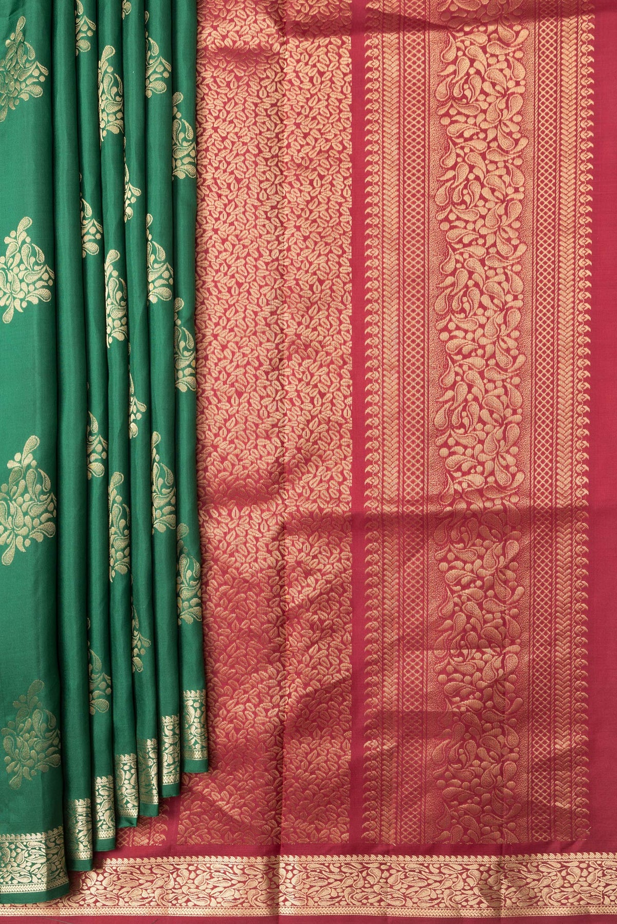 Pleats and pallu of Bottle Green Dual Tone Soft Silk Saree with Zari Butta on the body and Zari Border. 