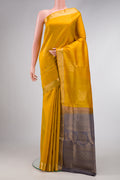 Mustard Dual Tone Soft Silk Saree with Zari Butta on the body and Zari Border.  displayed on a mannequin