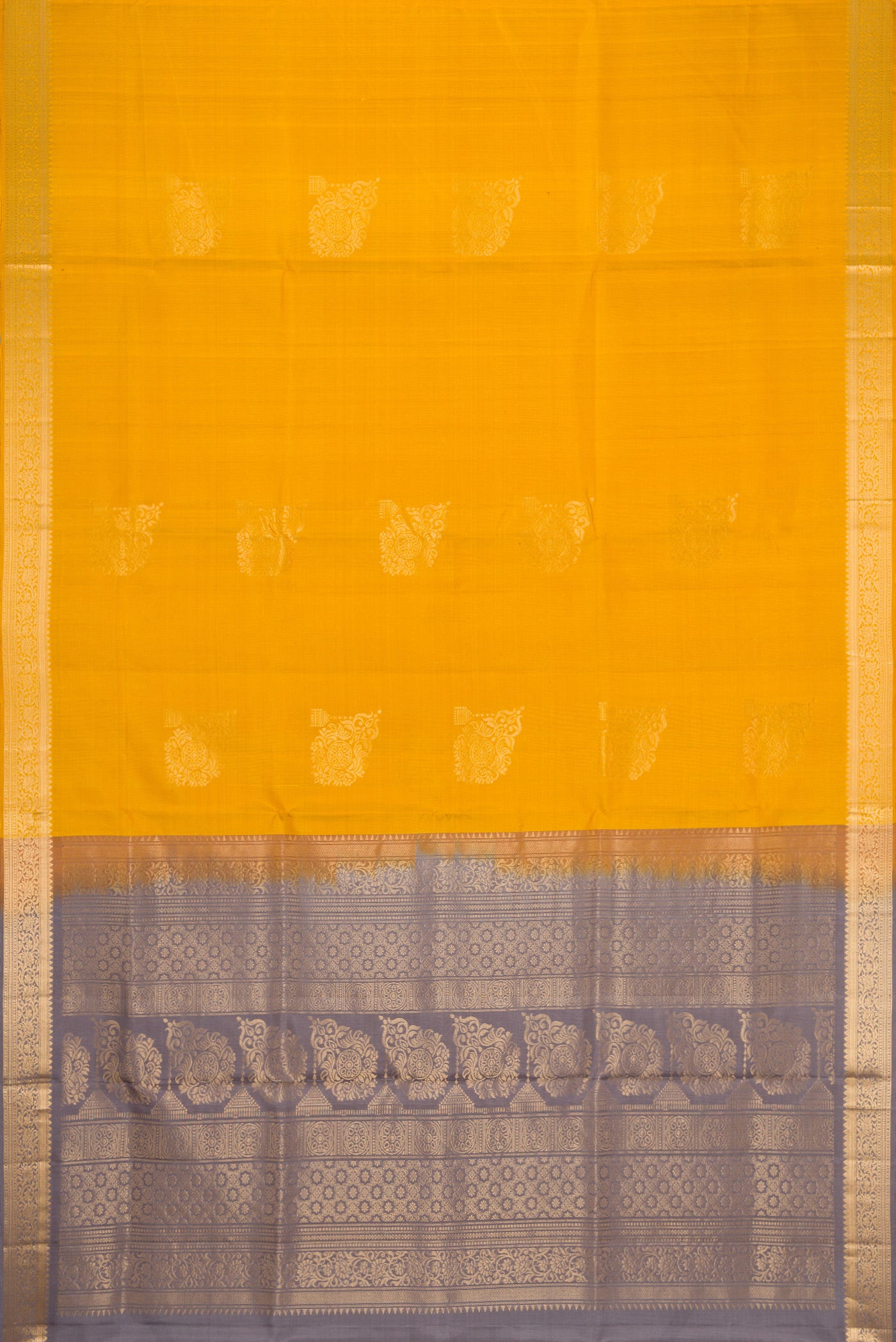 Flat view of Mustard Dual Tone Soft Silk Saree with Zari Butta on the body and Zari Border. 