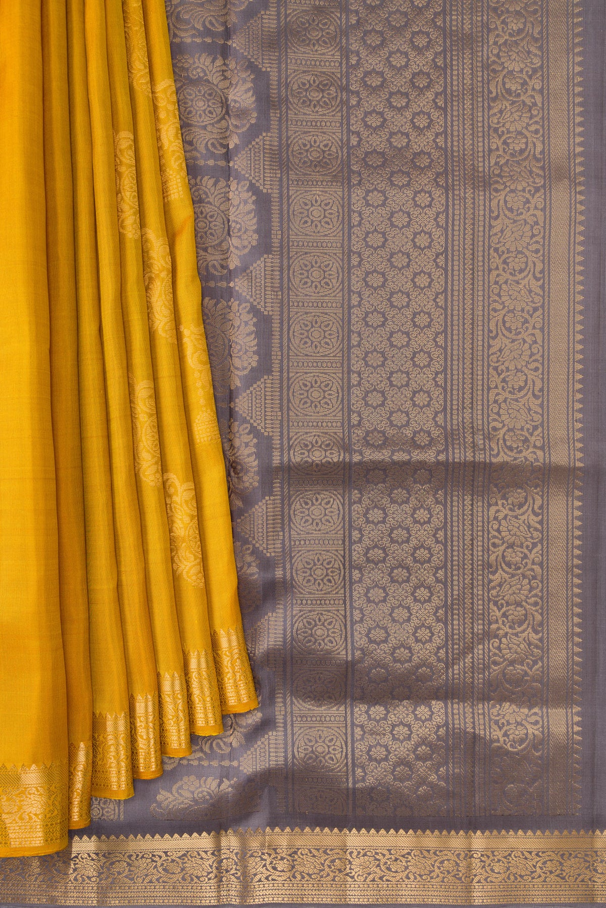 Pleats and pallu of Mustard Dual Tone Soft Silk Saree with Zari Butta on the body and Zari Border. 