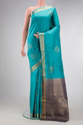 Light Blue Dual Tone Soft Silk Saree with Zari Butta on the body and Zari Border.  displayed on a mannequin